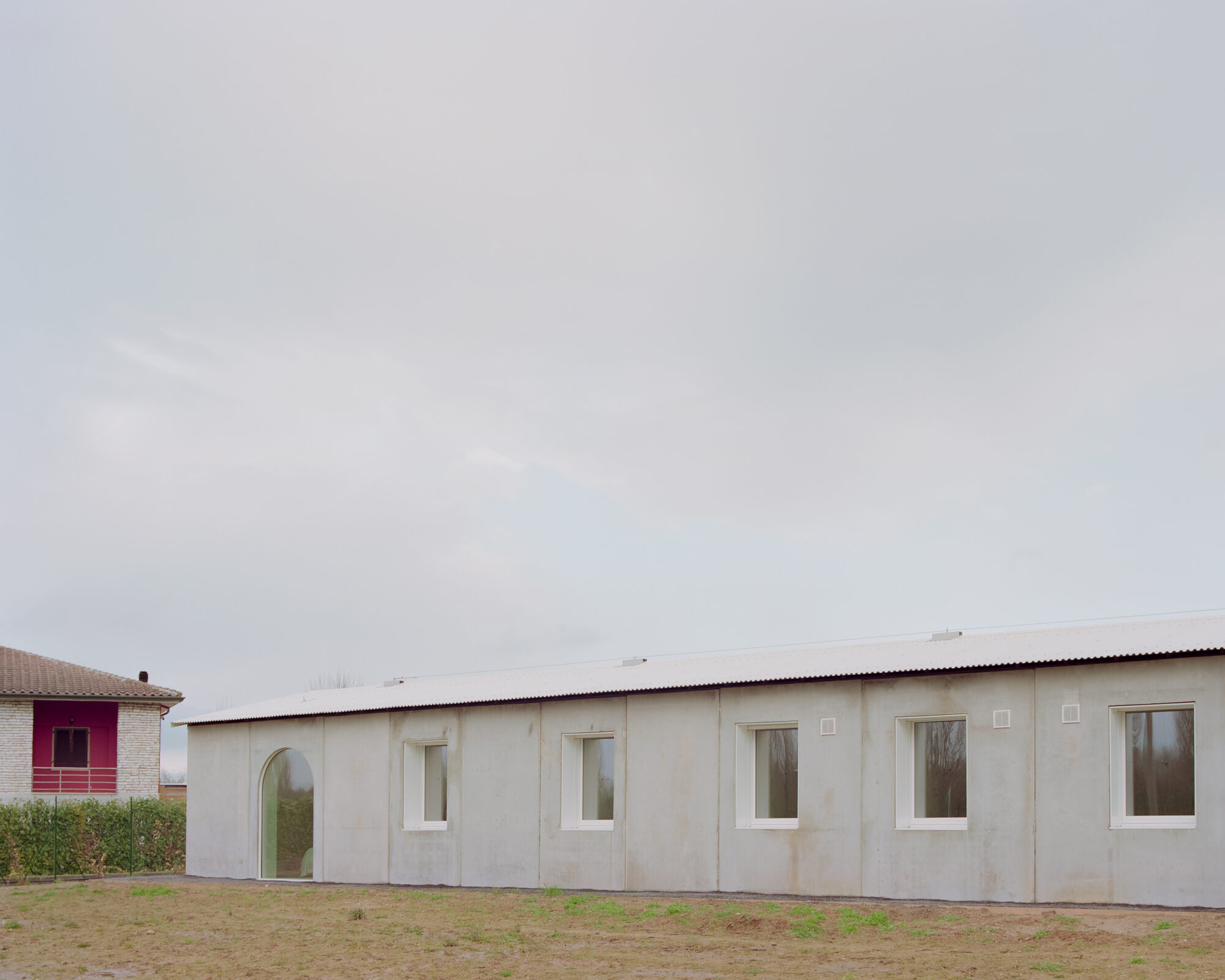 Casa GA by Archiplan Studio distils rural Po Valley architecture into concrete form