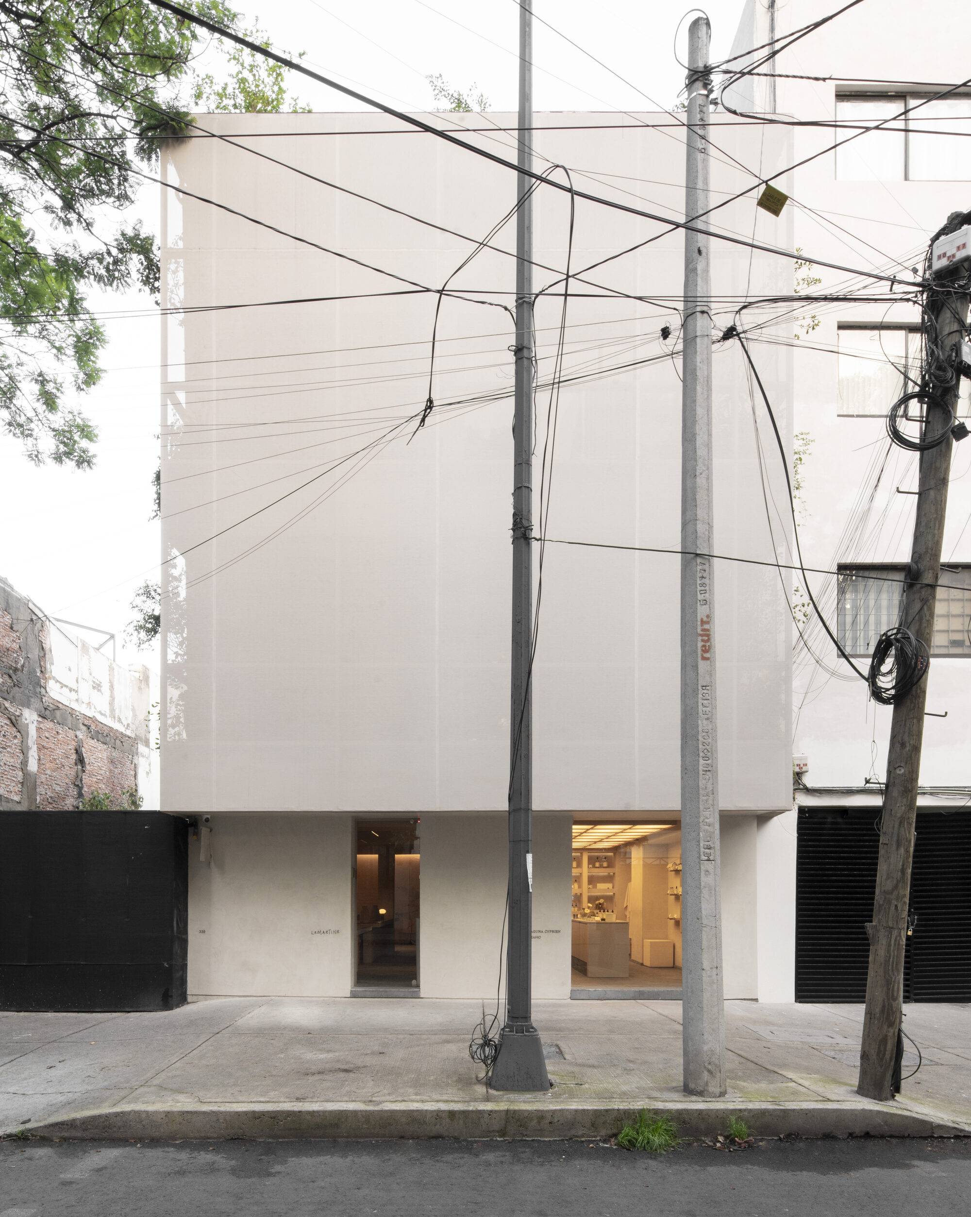 Skylit stair organises narrow hotel in Mexico City