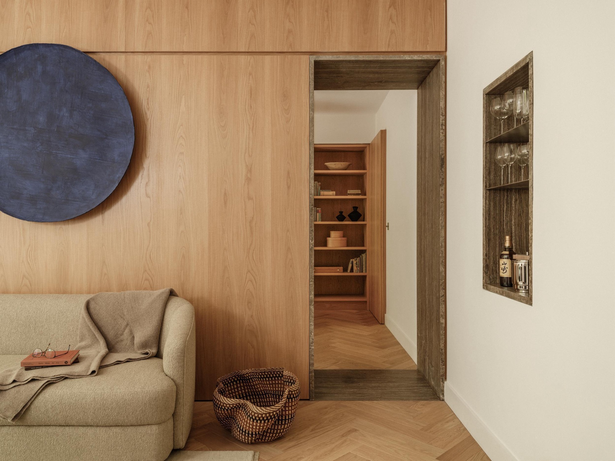 NENMAR transforms Battersea apartment into a calm London home lined with travertine and oak