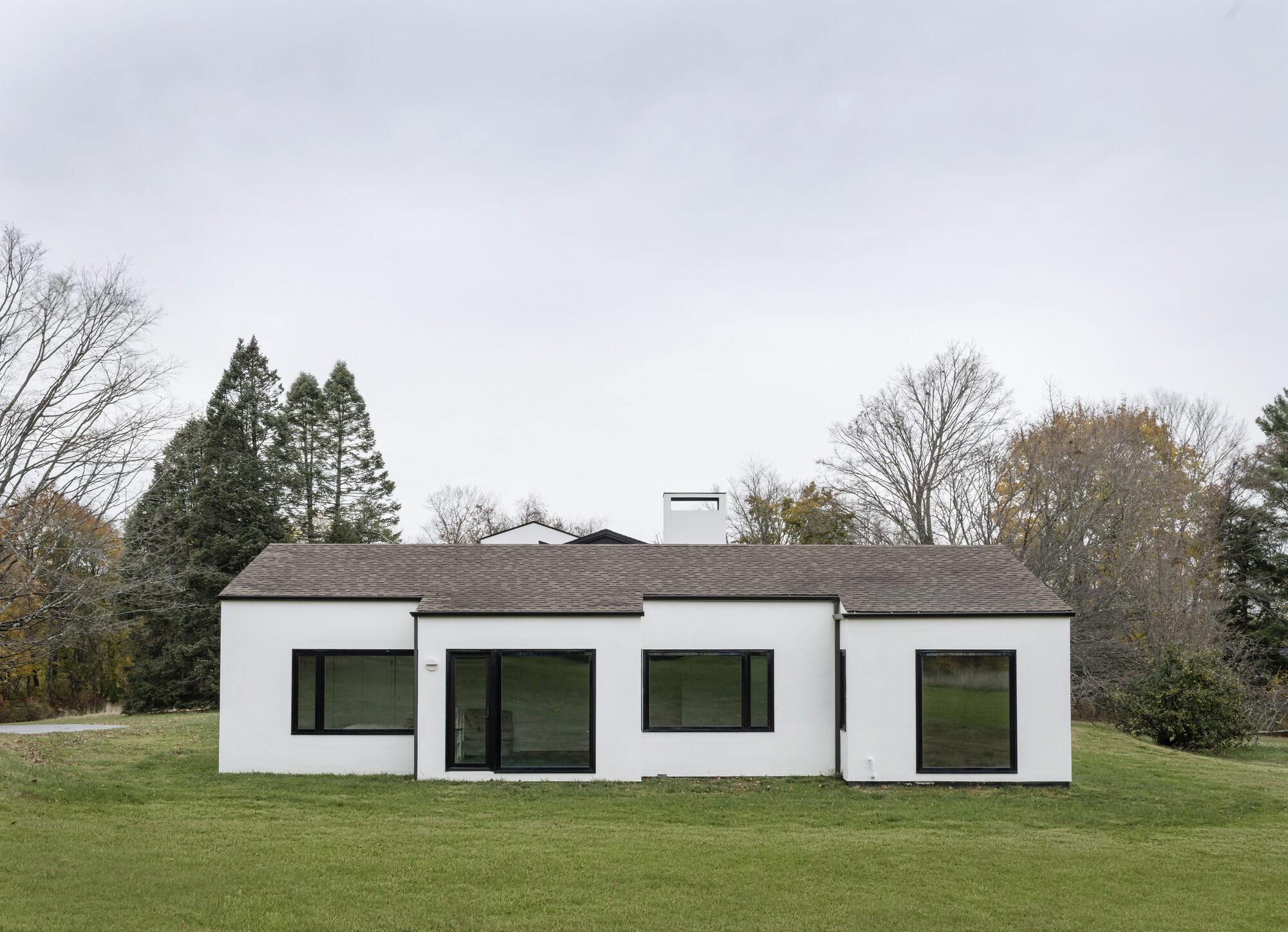TBo reworks 1970s Katonah house with split gables and expanded glazing