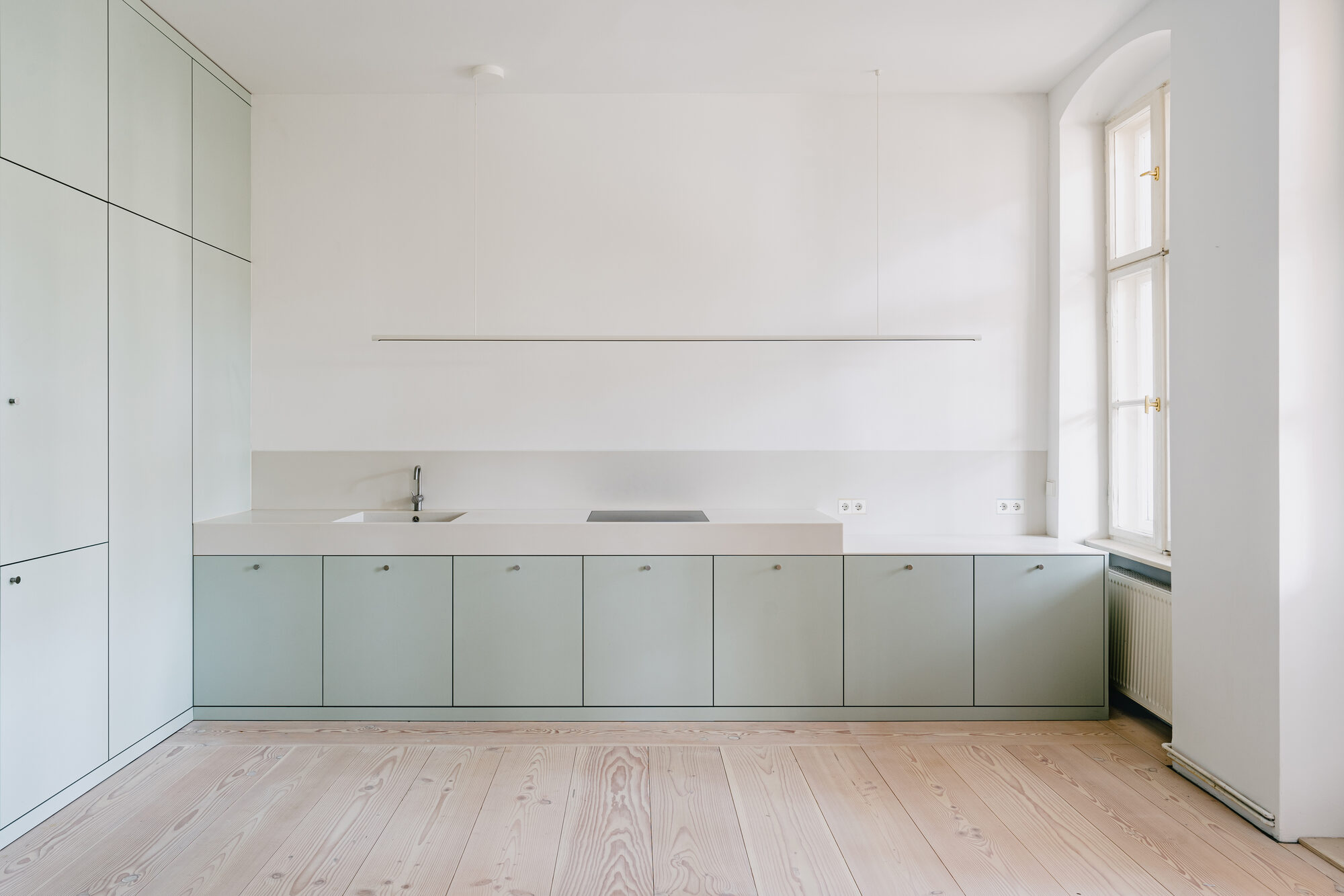 Studio Loes traces former walls in Douglas fir floor of Berlin apartment