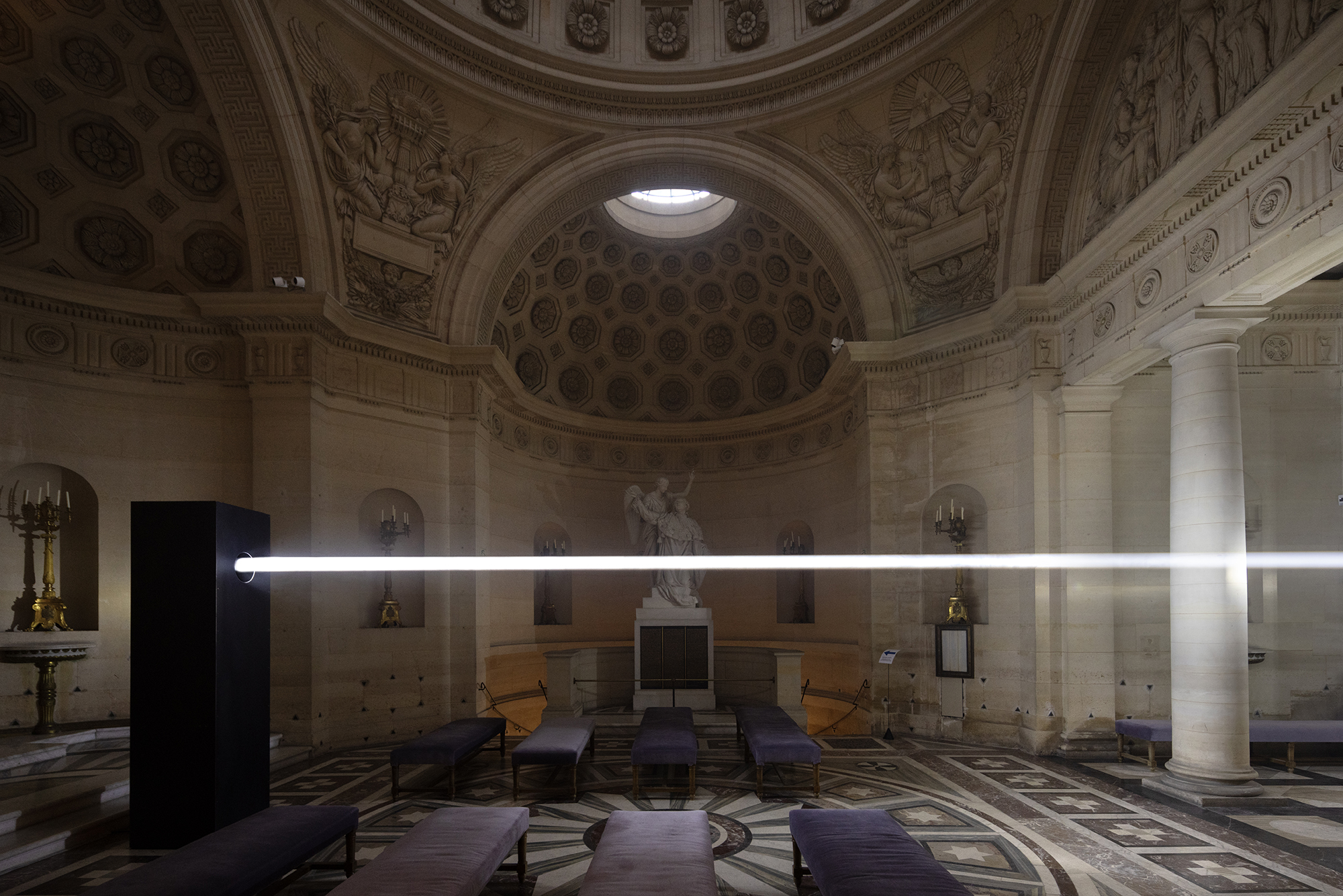 Emilio Ferro cuts a beam of white light through Paris' Chapelle Expiatoire