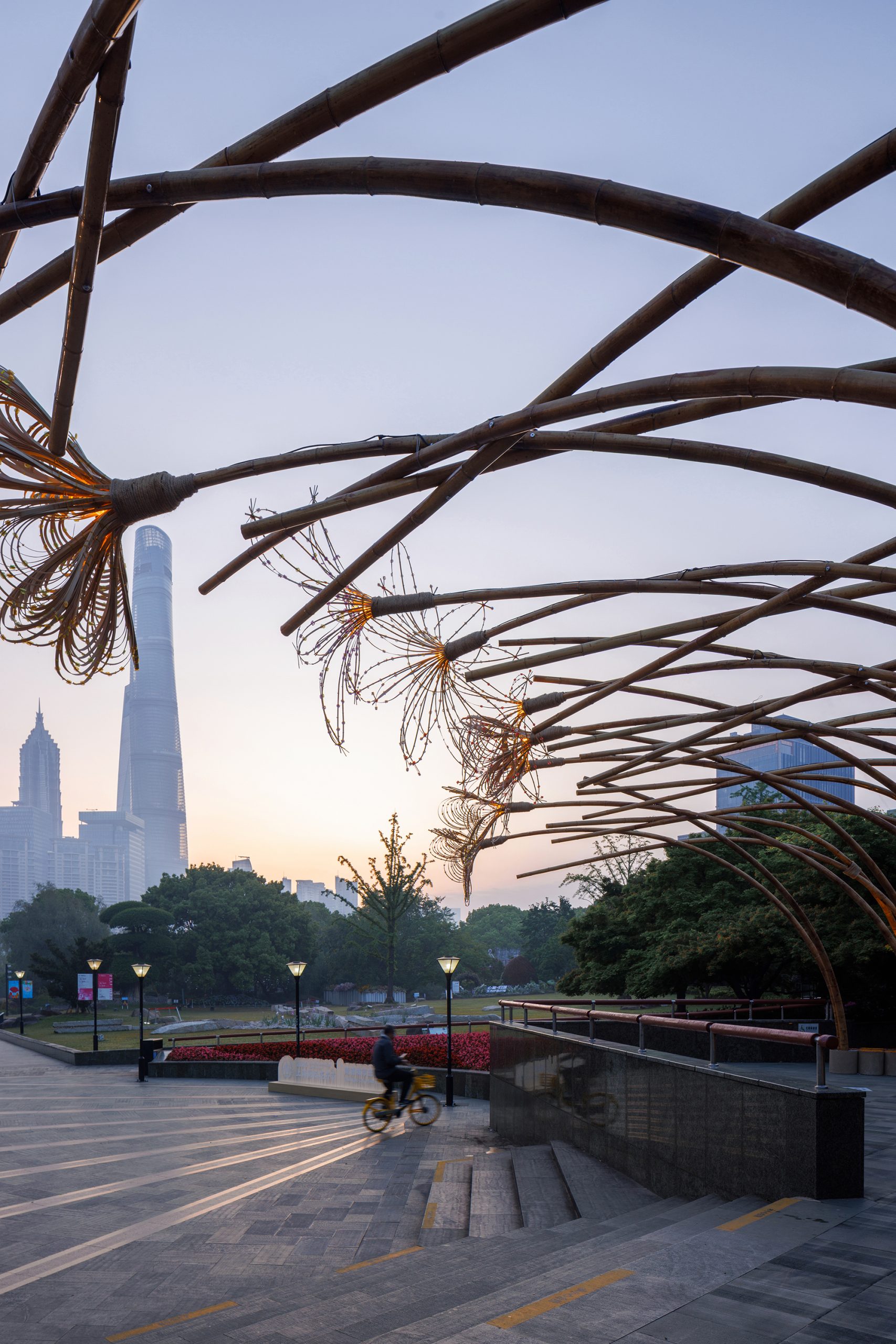 Bent by Spring bamboo canopy framing the Shanghai skyline