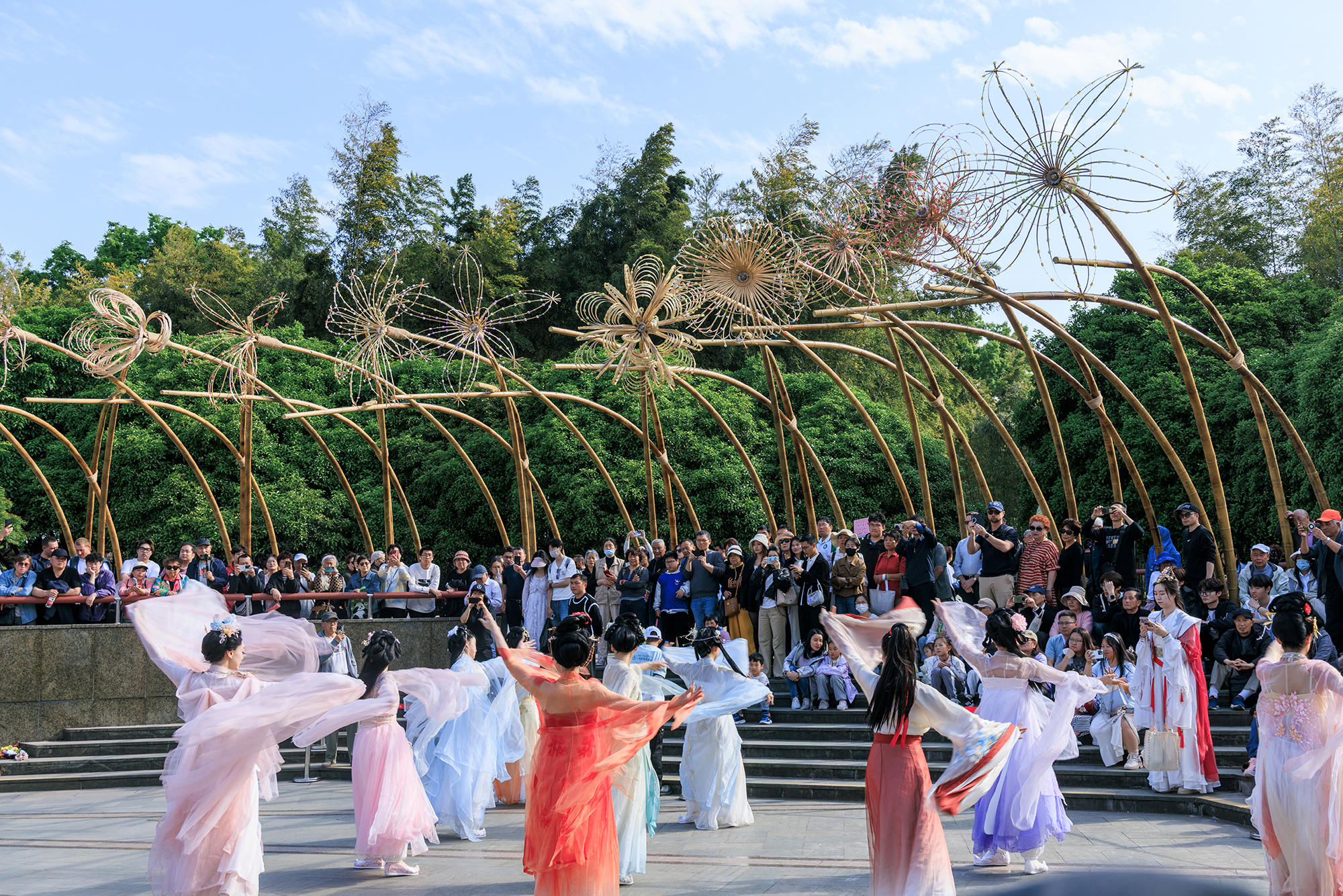 Public event beneath Bent by Spring bamboo canopy in Gucheng Park