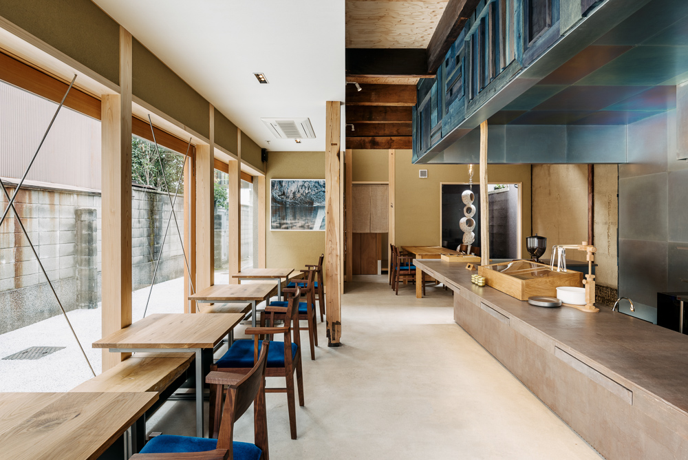 KYOTO WAND interior with indigo-dyed wood kitchen volume and restored machiya structure