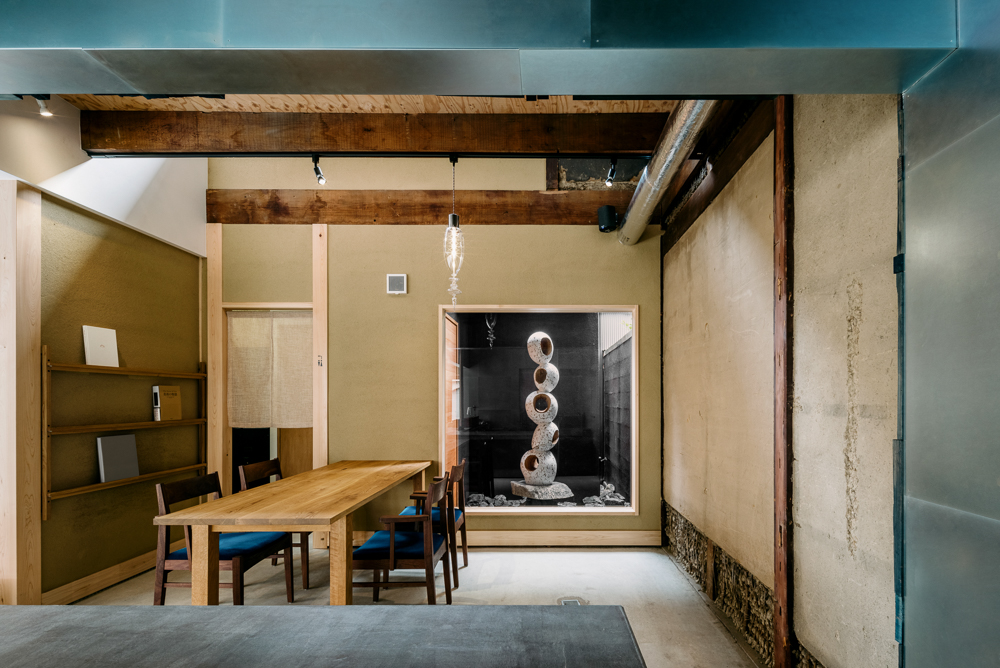 Upper-floor seating area at KYOTO WAND with exposed timber beams