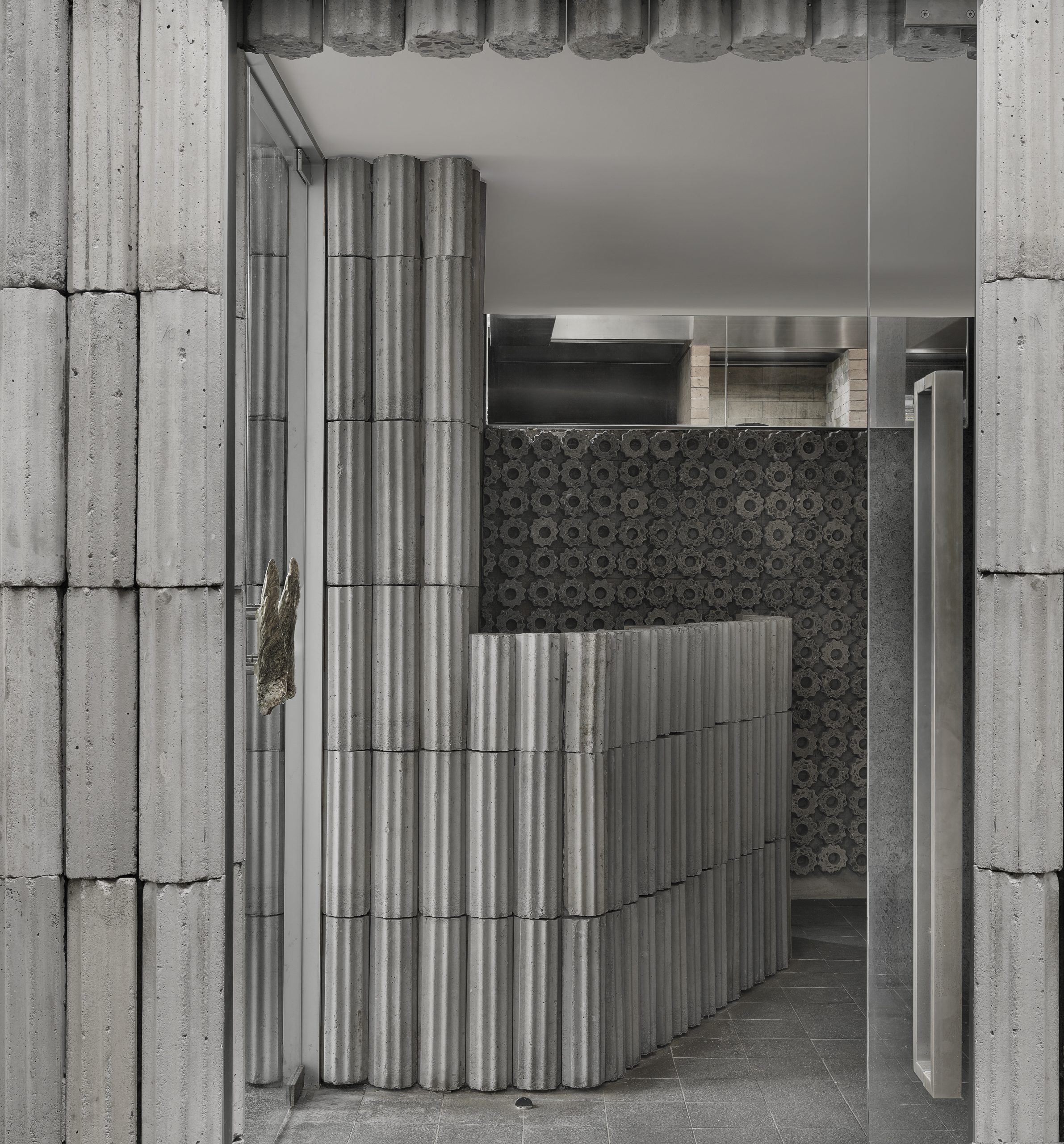 PHTAA Living Design reinterprets oyster-farming concrete blocks for Scale fish butchery in Bangkok