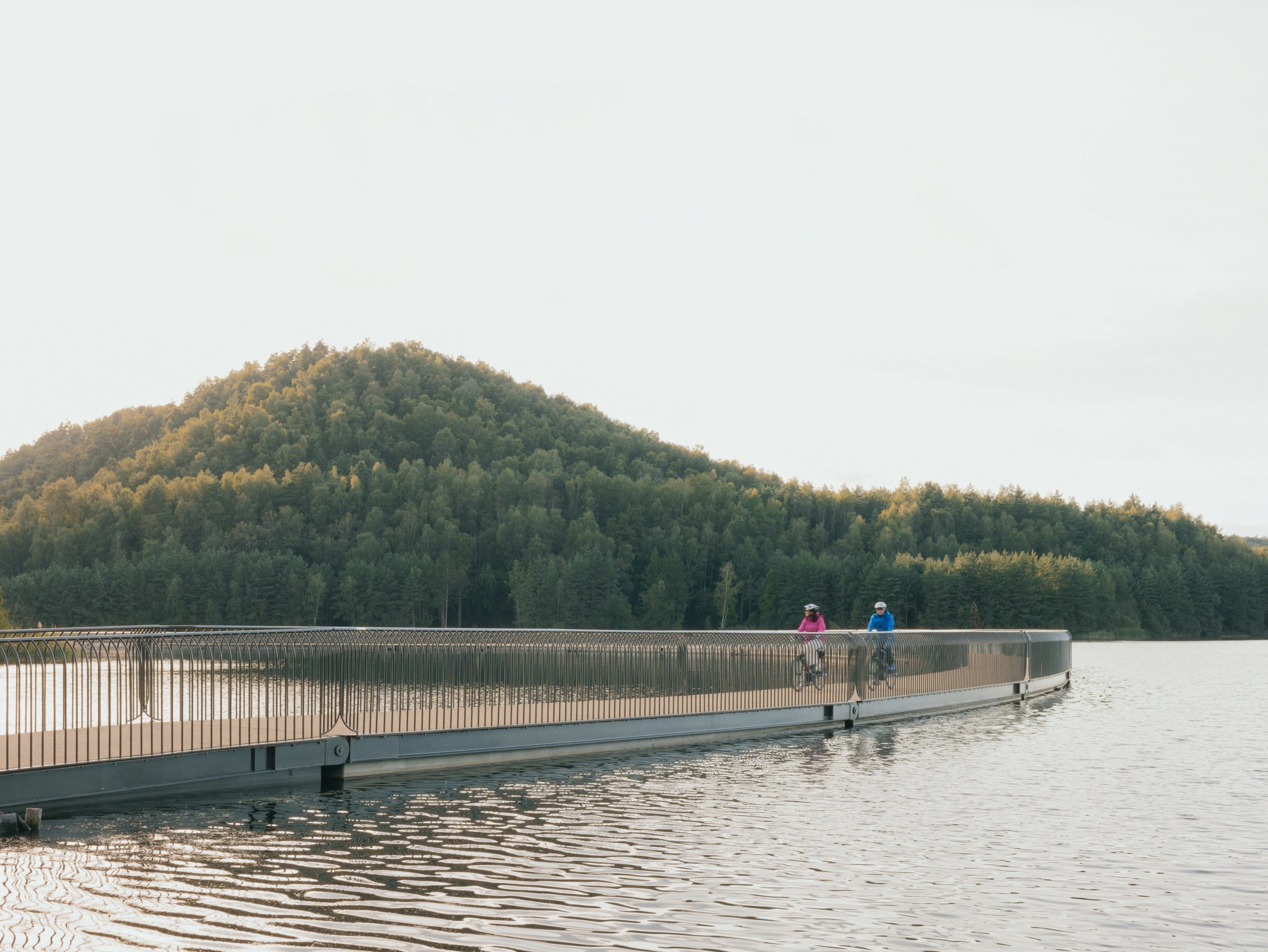 Curving floating cycling bridge at Terhills in Limburg Belgium