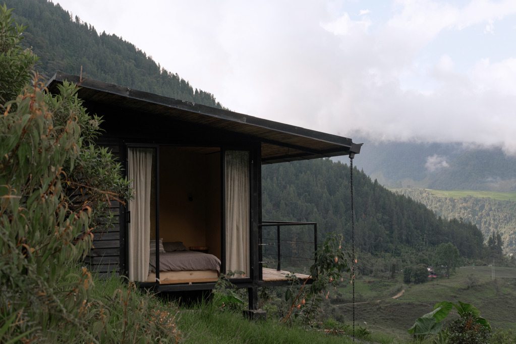 Lookout cabin embedded in the mountain landscape at Water Stories