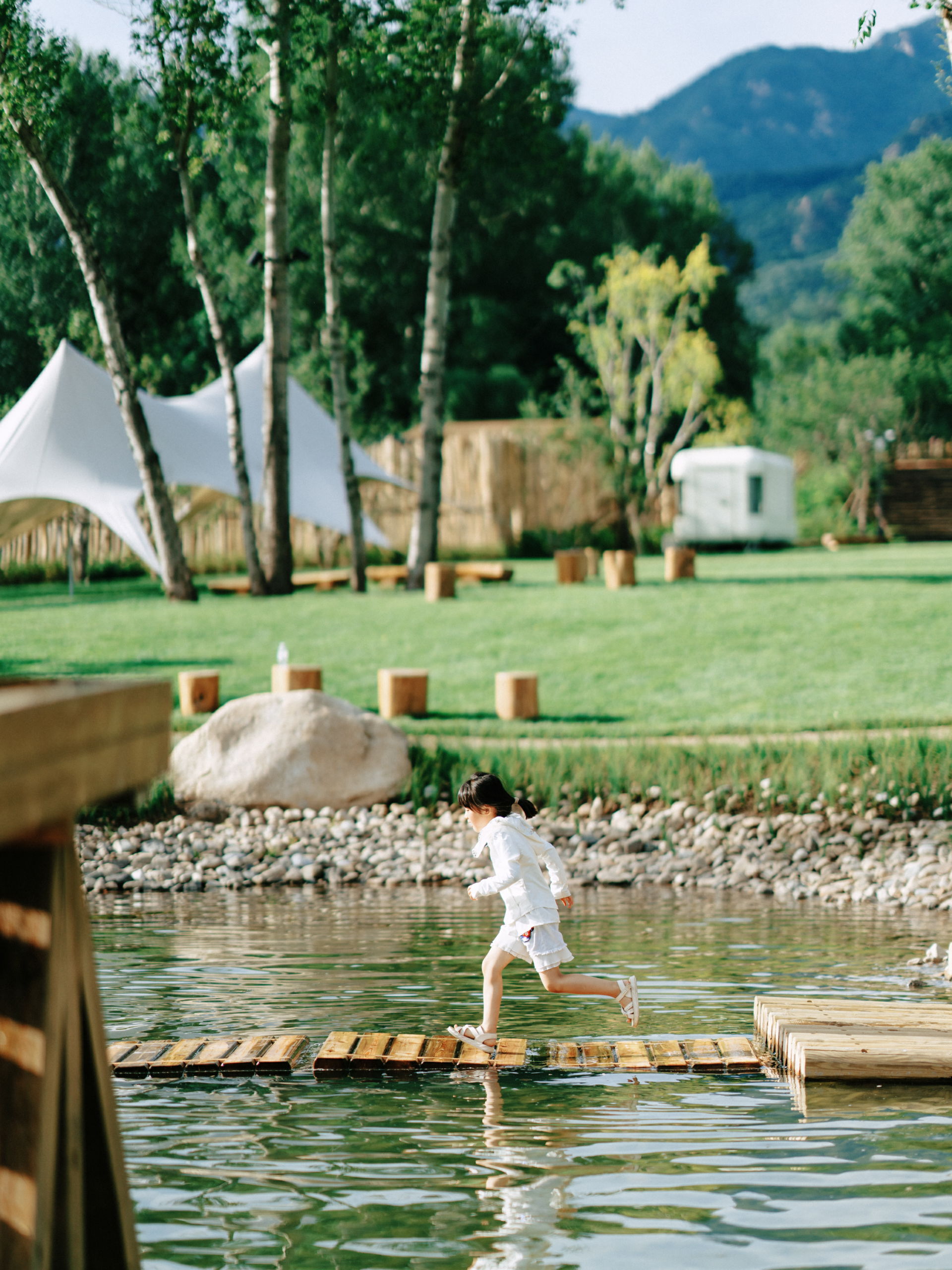 Children running on the floating bridge at Forest Delight