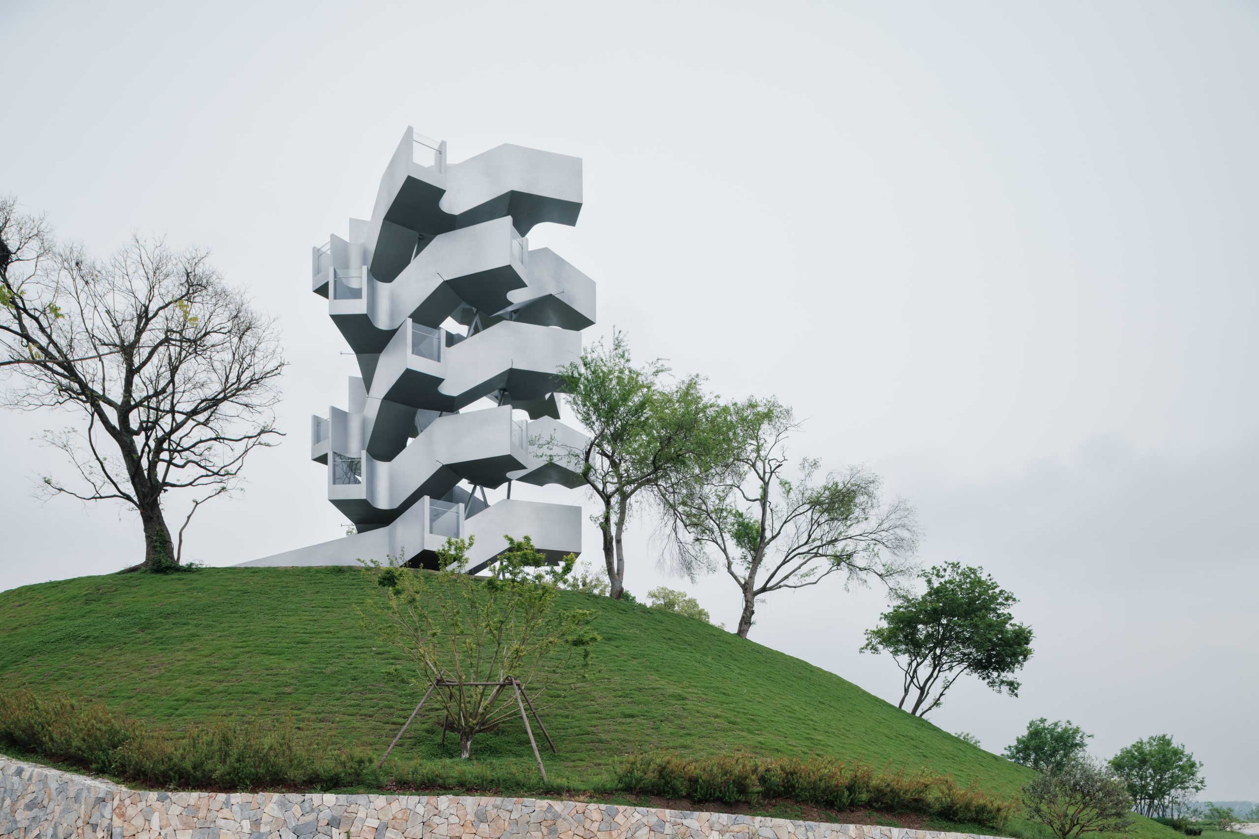 Silver metal observation tower rising above Chenhu Wetland in Wuhan