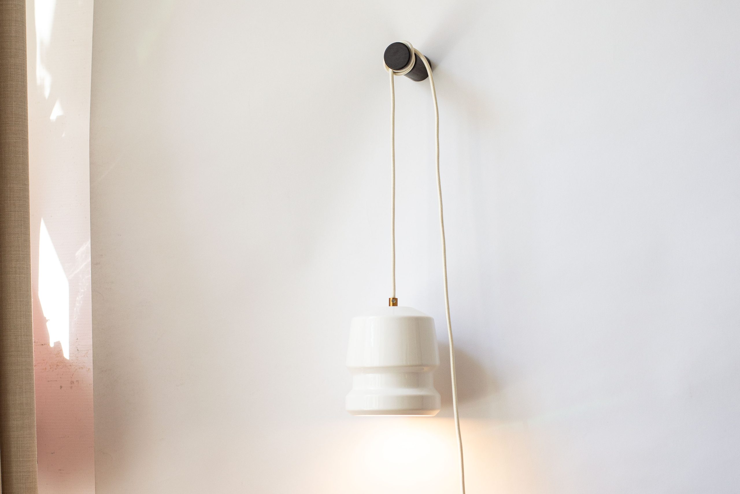 Detail of Temple portable lamp with brass cable clamp