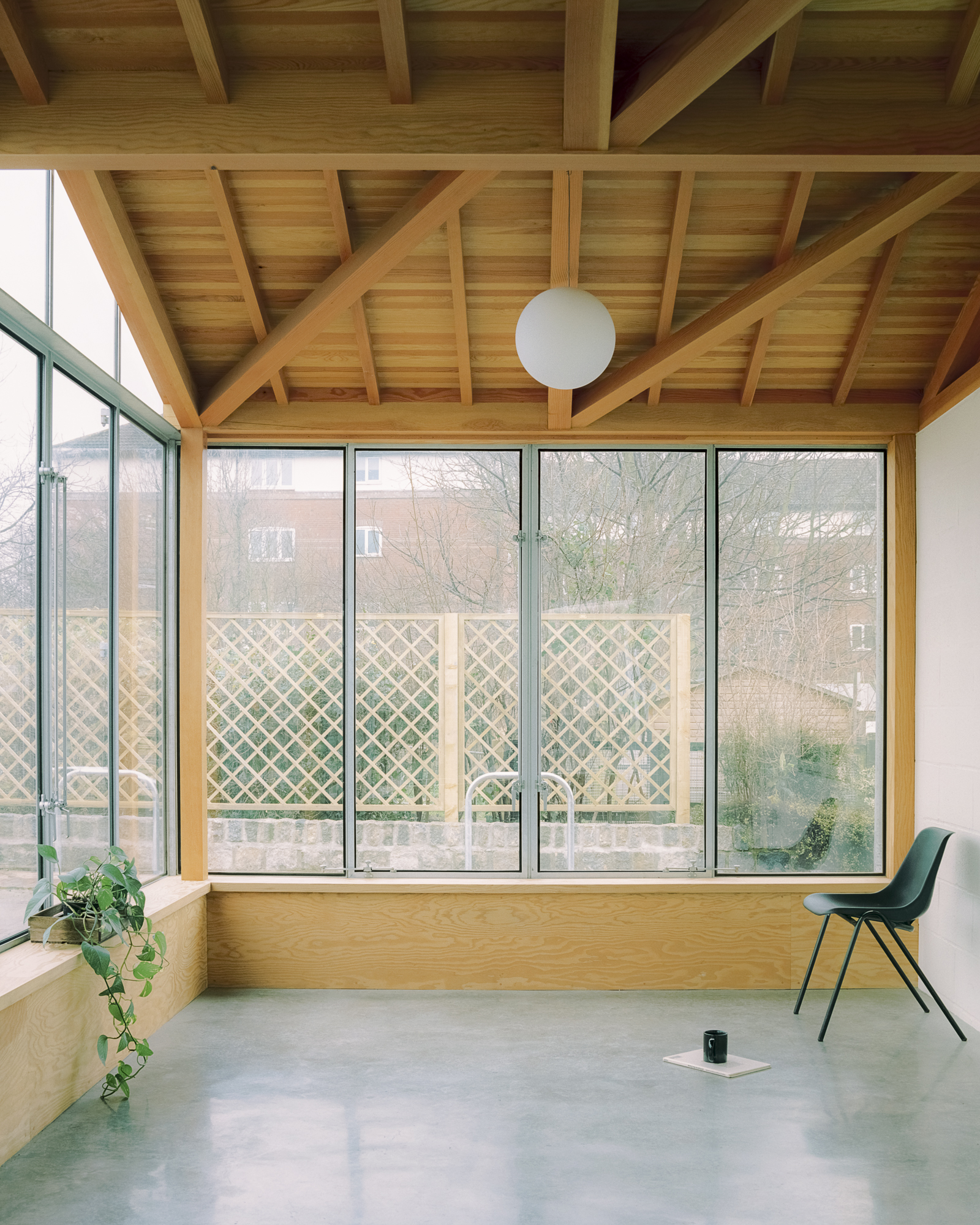Glazed riverside extension at Surrey Docks Farm by Pup Architects. Photo by Simone Bossi.
