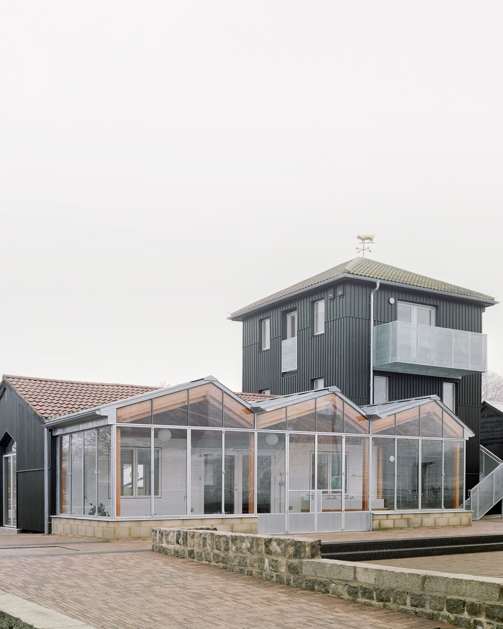 East elevation of Surrey Docks Farm facing the Thames by Pup Architects. Photo by Simone Bossi.