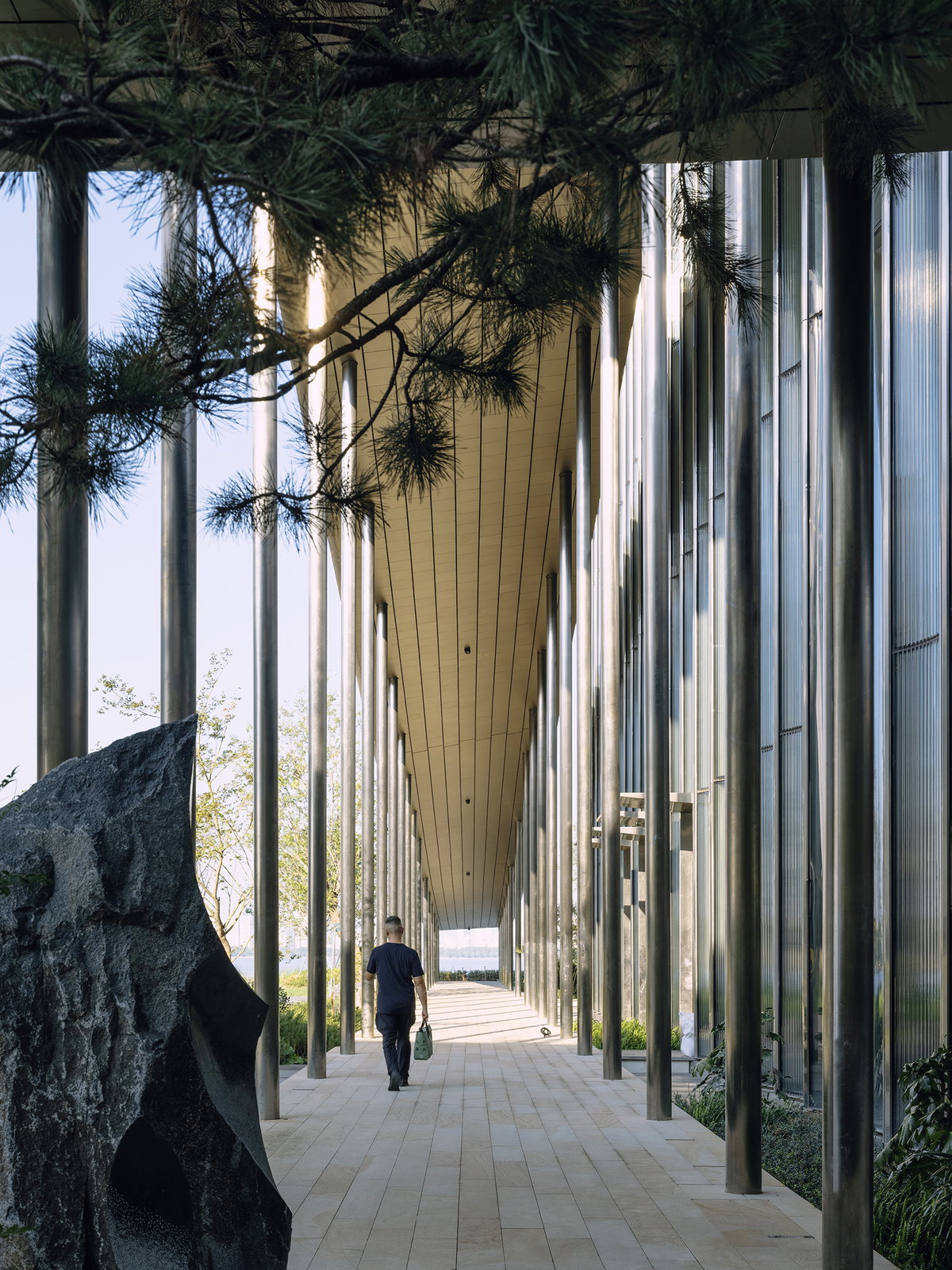 Covered pathway winding between the museum pavilions