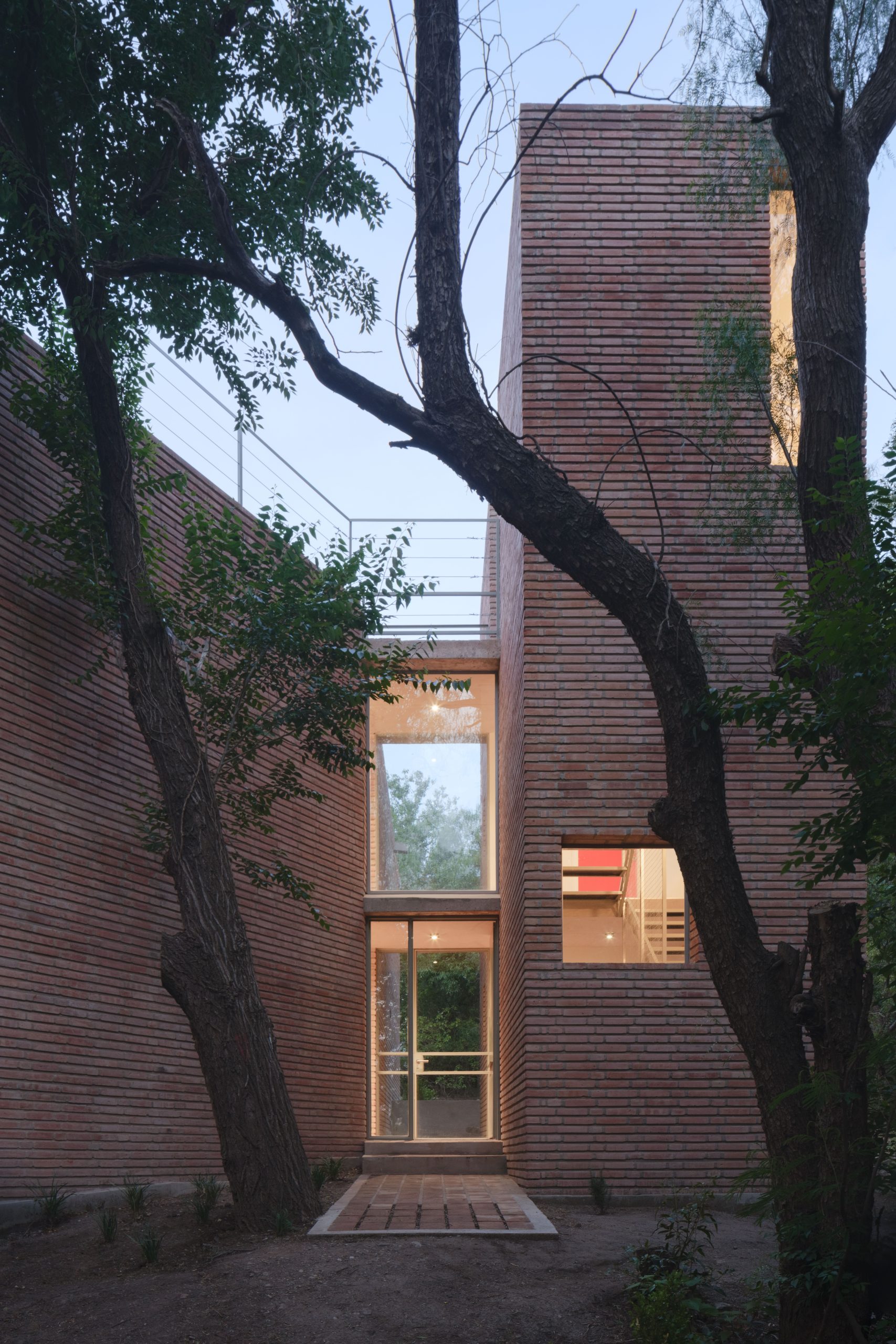 Walkable roof terrace and brick volumes at Atelier Cambre