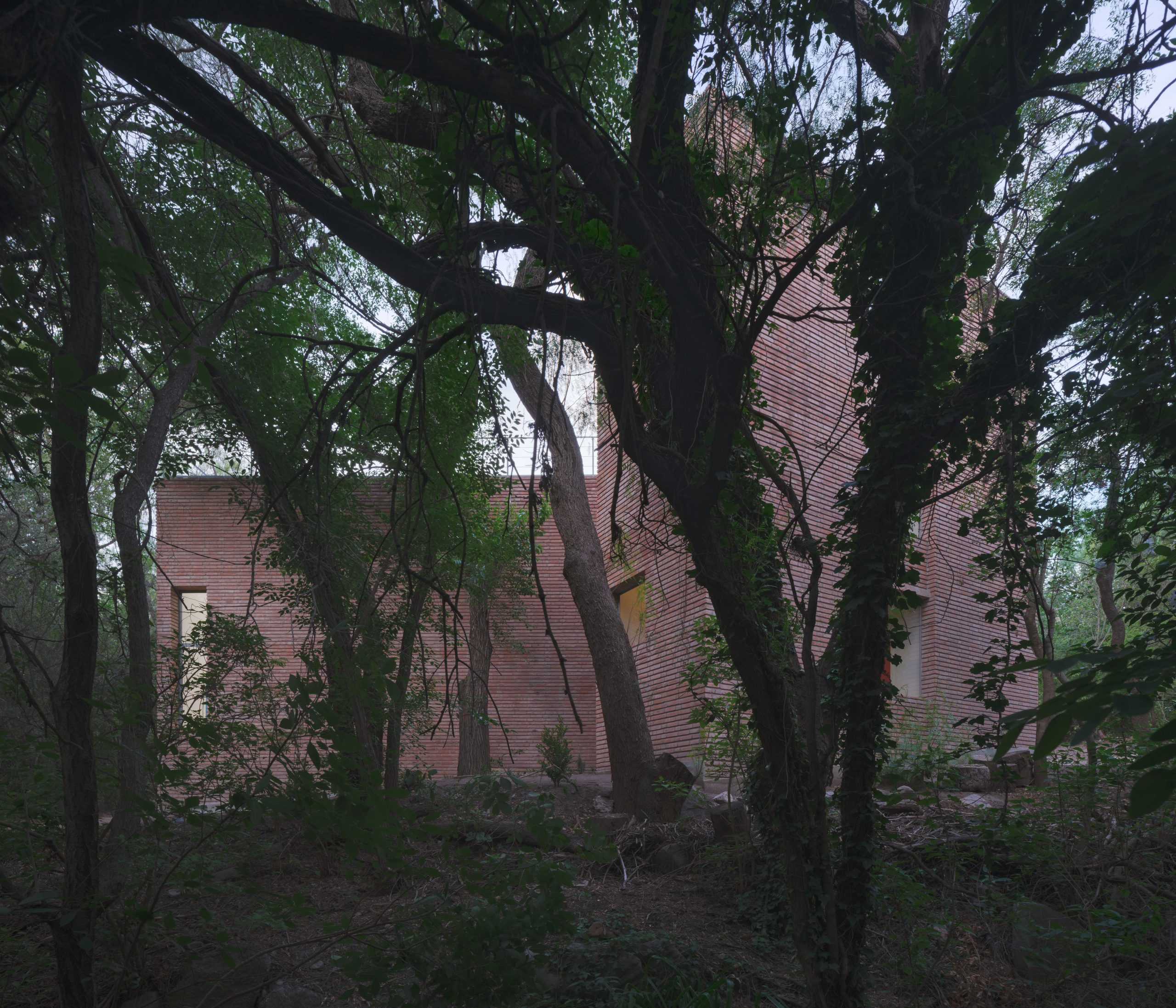 Entrance sequence between the rotated brick volumes of Atelier Cambre