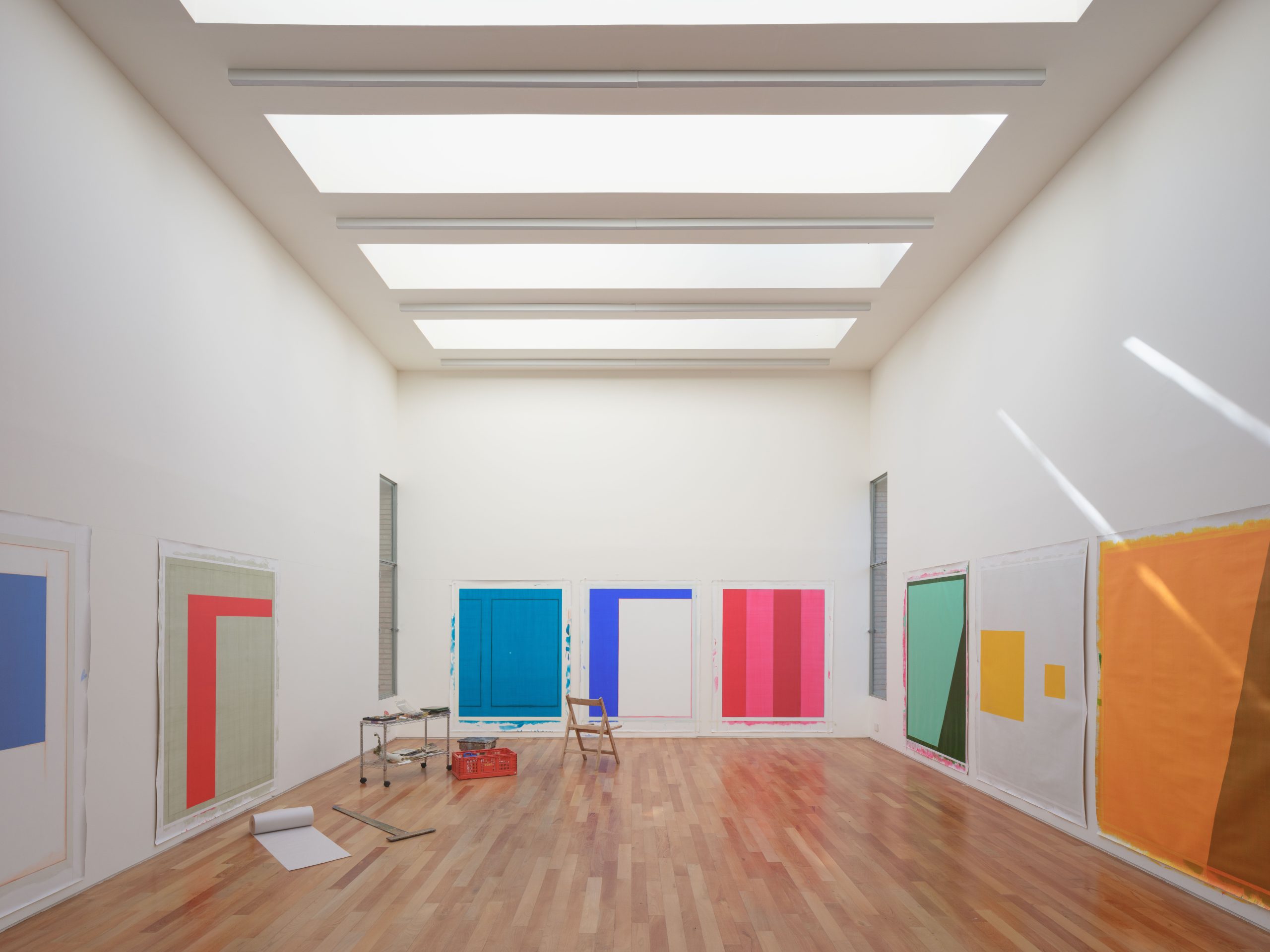 Wood and white-painted brick interior of Atelier Cambre