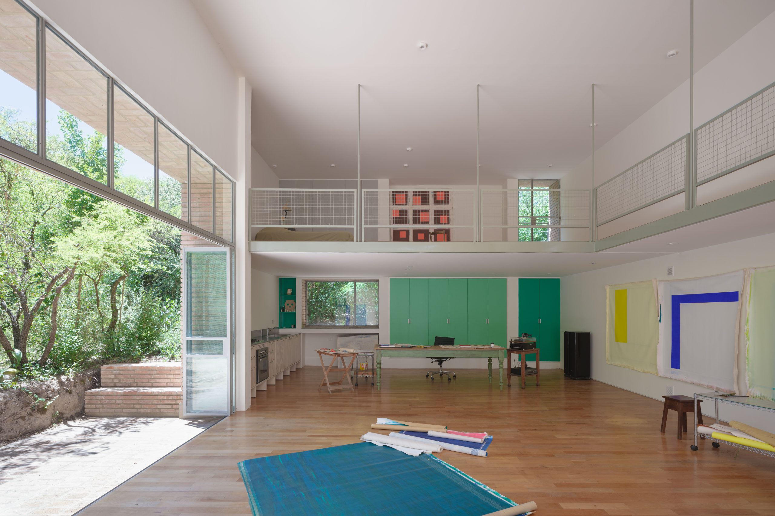 Open mezzanine overlooking the double-height studio at Atelier Cambre