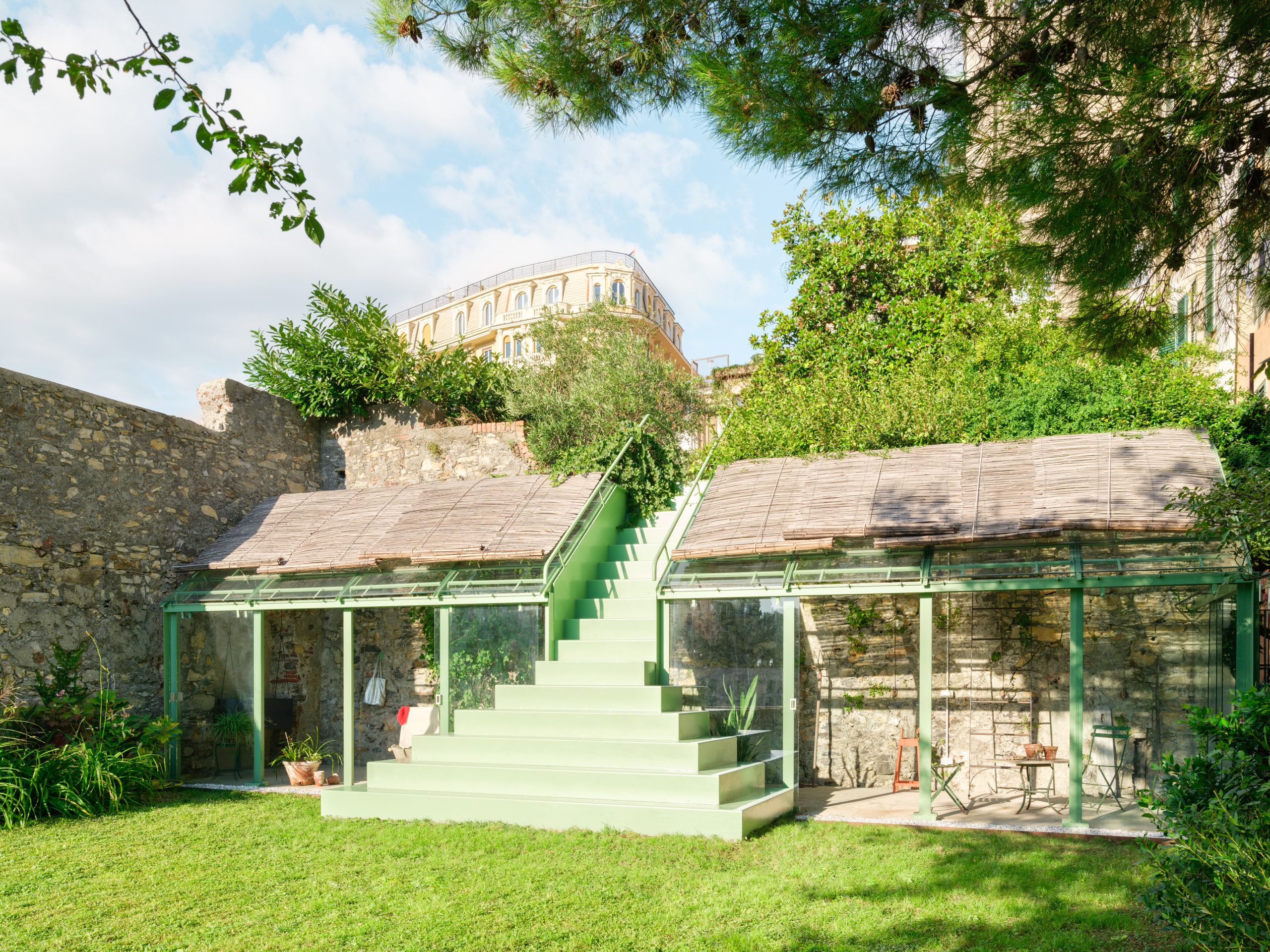 Caarpa threads a pistachio-green staircase through a Genoa garden