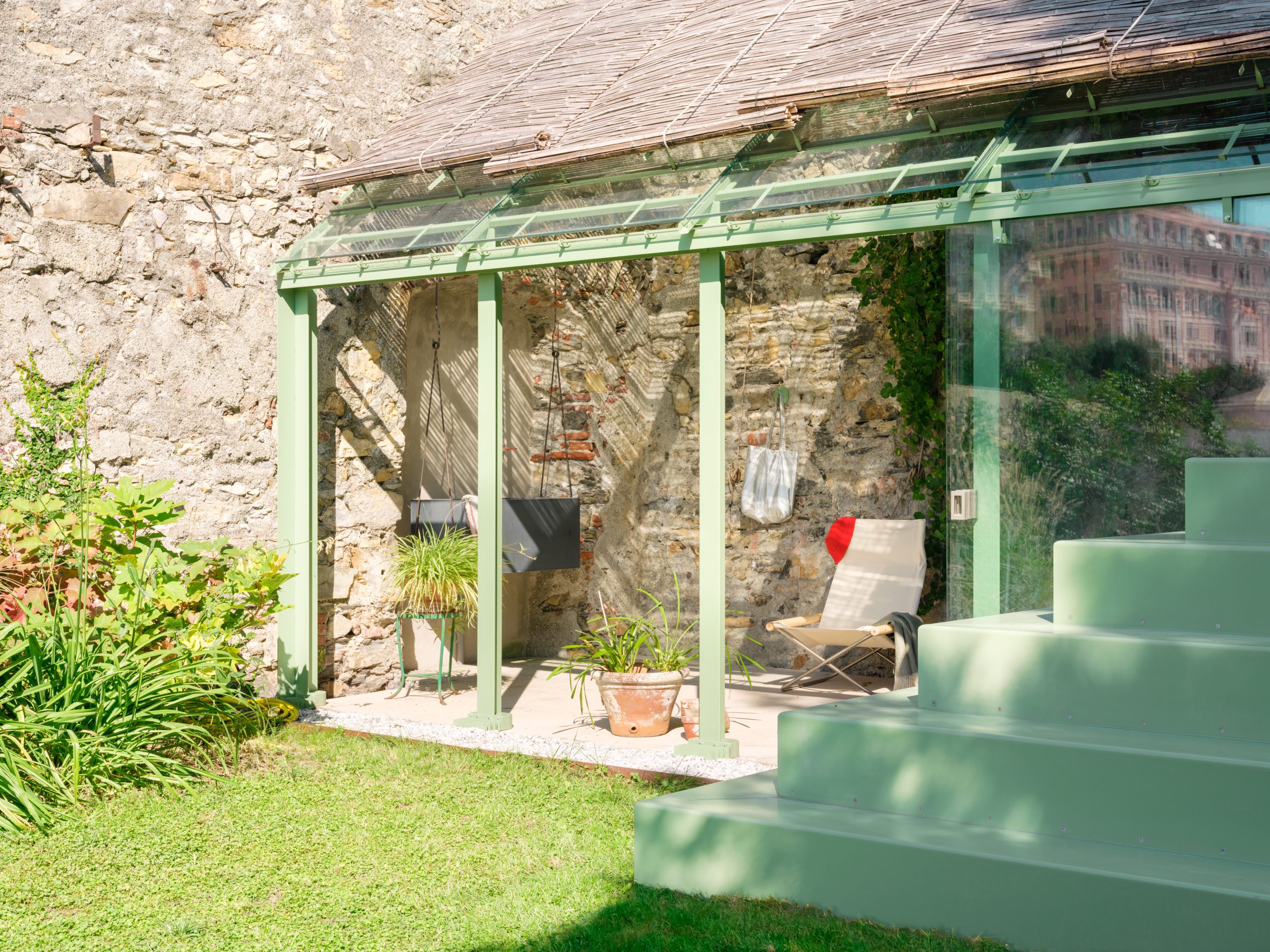 Historic stone walls and contemporary steel elements at Scala San Filippo