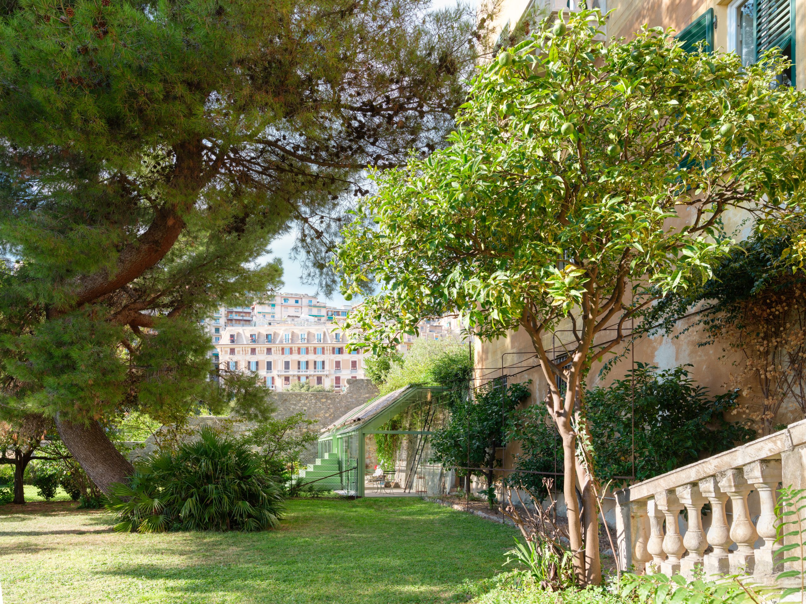 Elevated stair landing framing a view across the garden