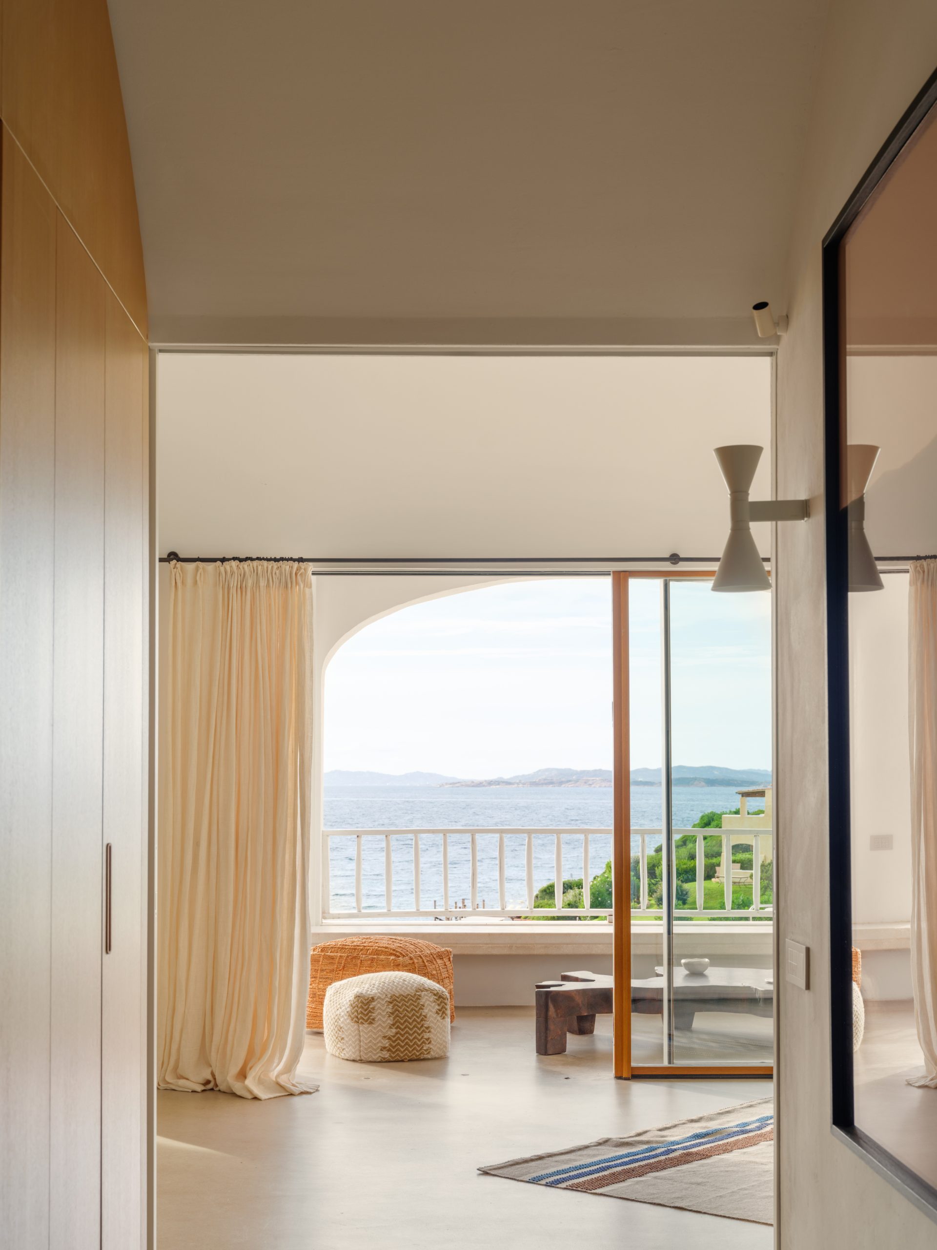 Frameless glazing connecting the living room and loggia