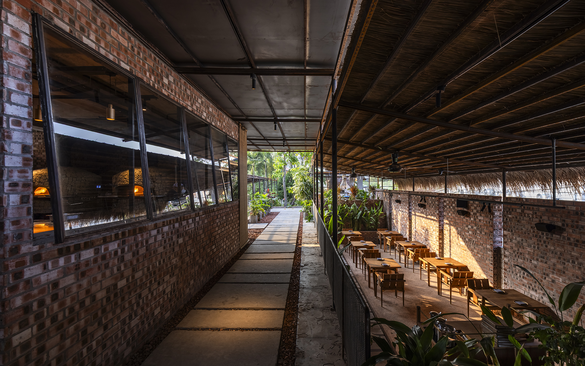 Former swimming pool retained as a semi-outdoor dining area at Pizza 4P’s Thao Dien