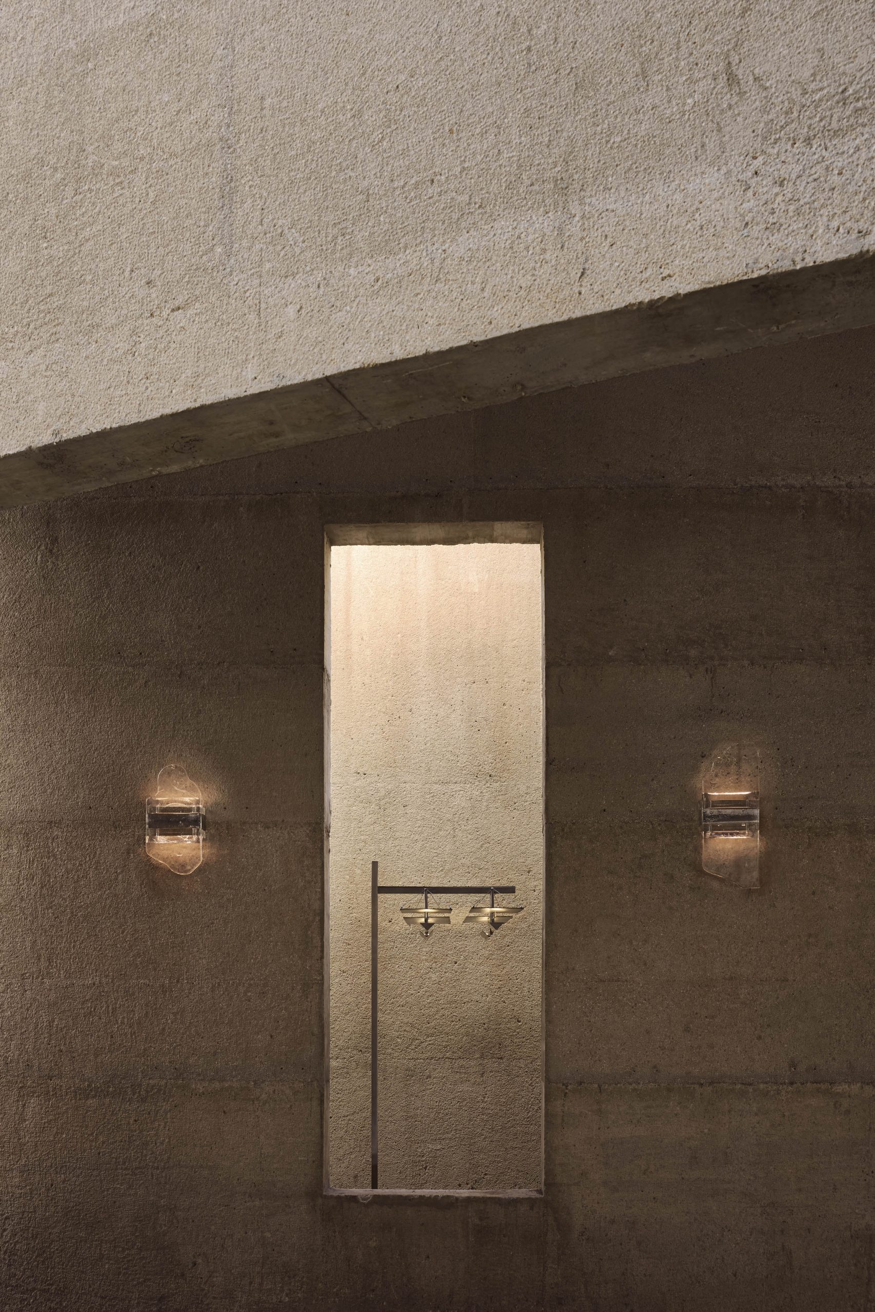 Concrete doorway and wall lights at Casa Ínsula
