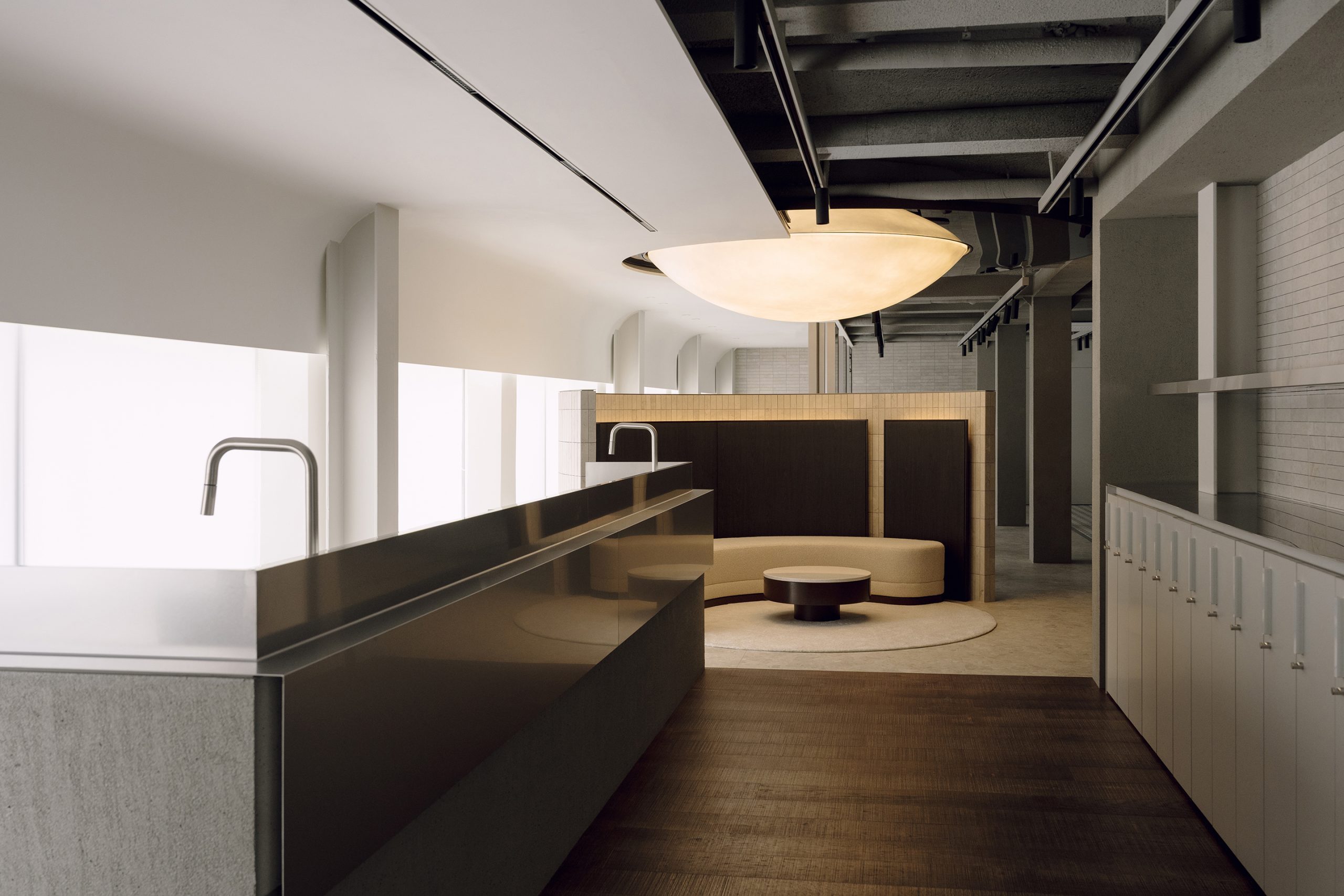 Linear salon interior with a circular ceiling light