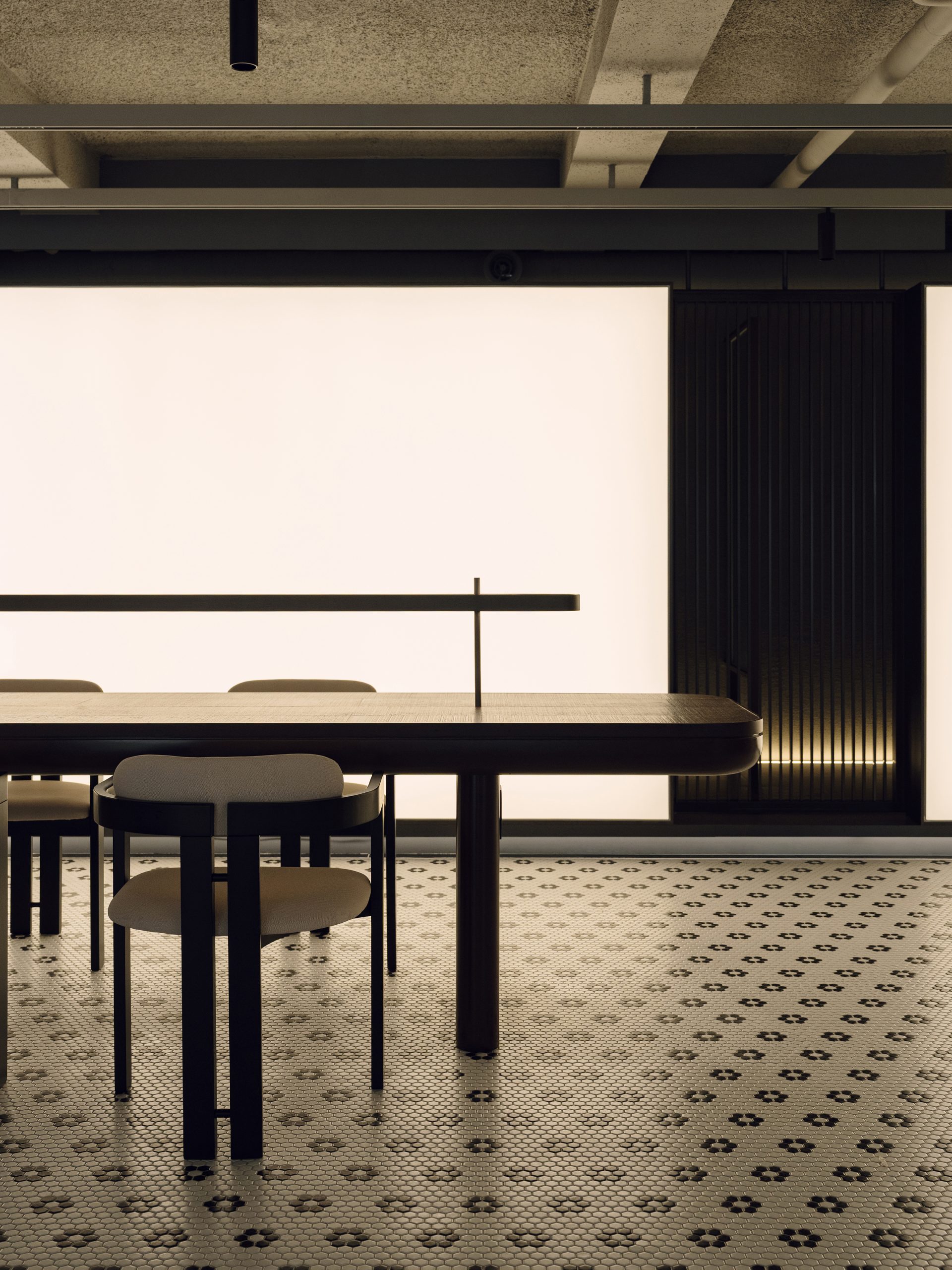 Styling station beneath the exposed industrial ceiling