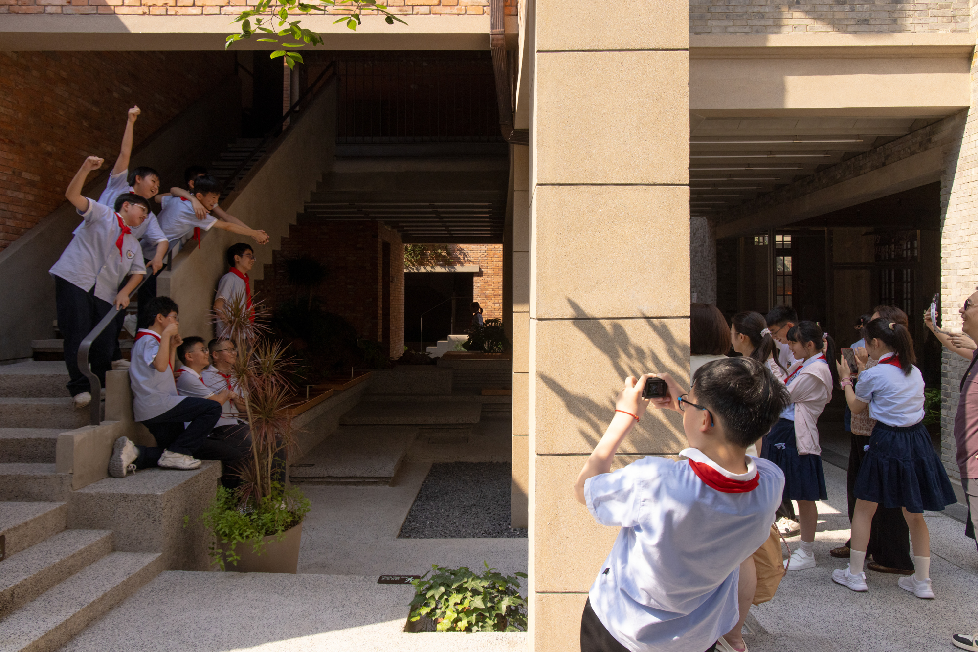 Planting and seating animate a central courtyard at Yanqing Li