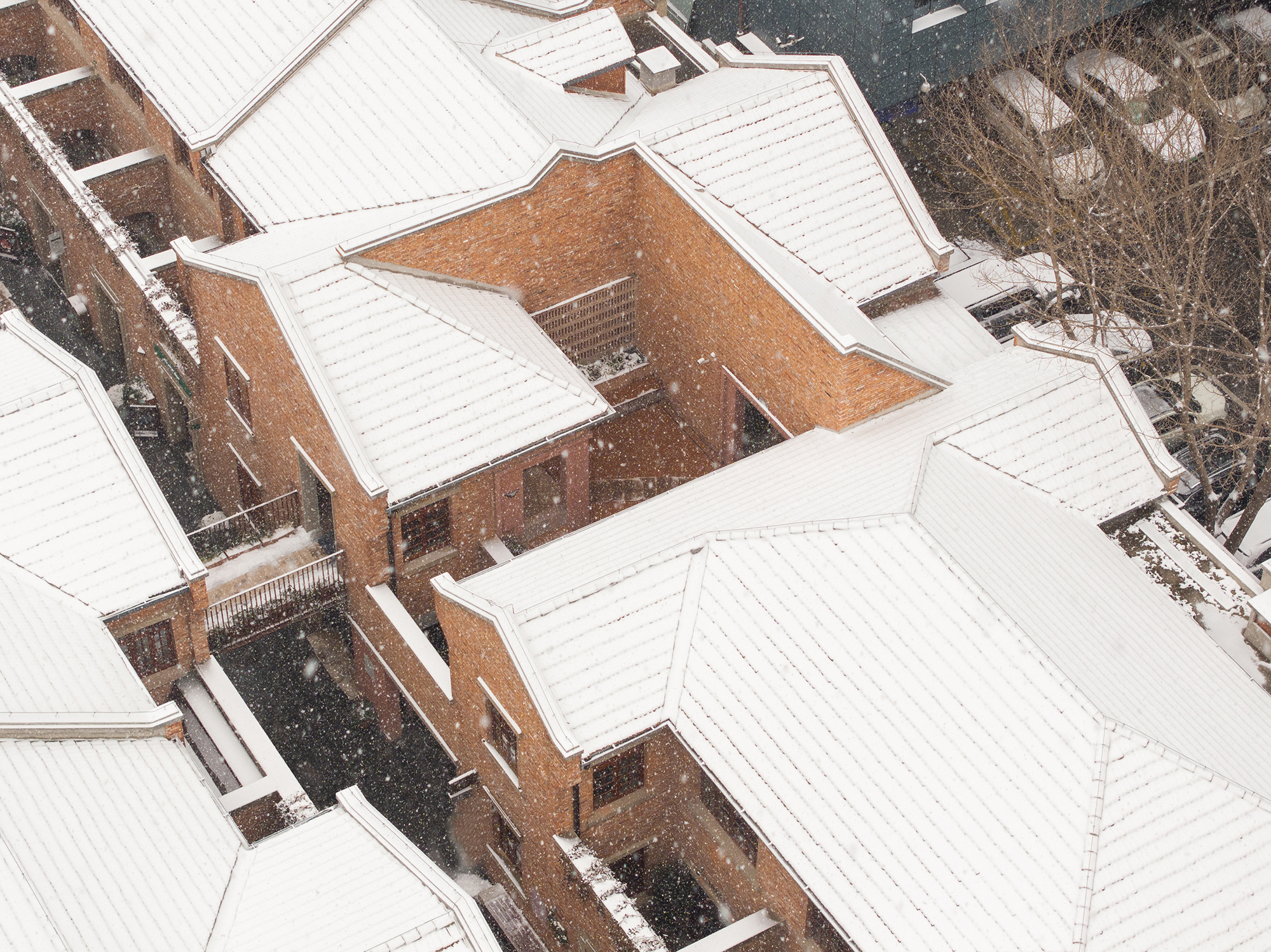 A winter aerial view shows the seven-building compound and surrounding streets