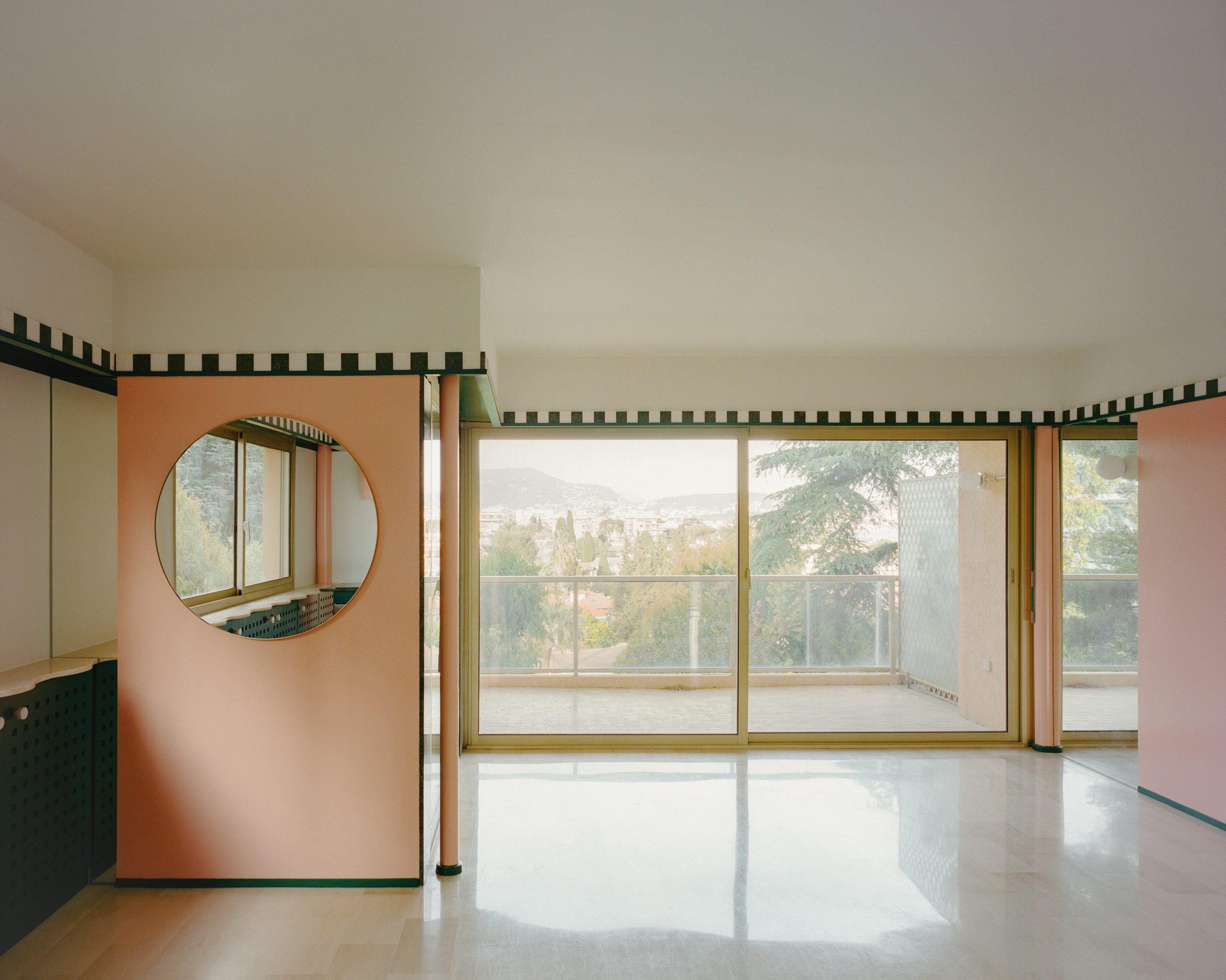 Apricot planes and green bands shape Fabron apartment by Continentale