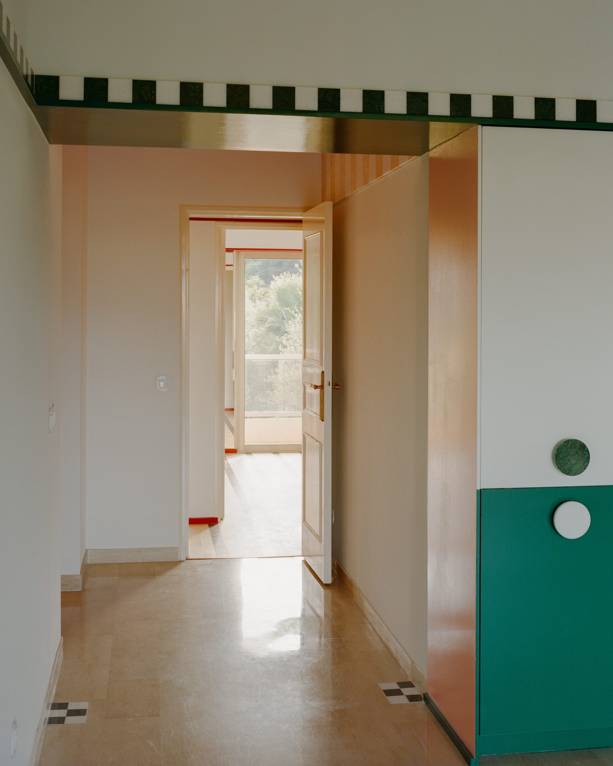 View from the living room towards a bedroom in the renovated Fabron apartment
