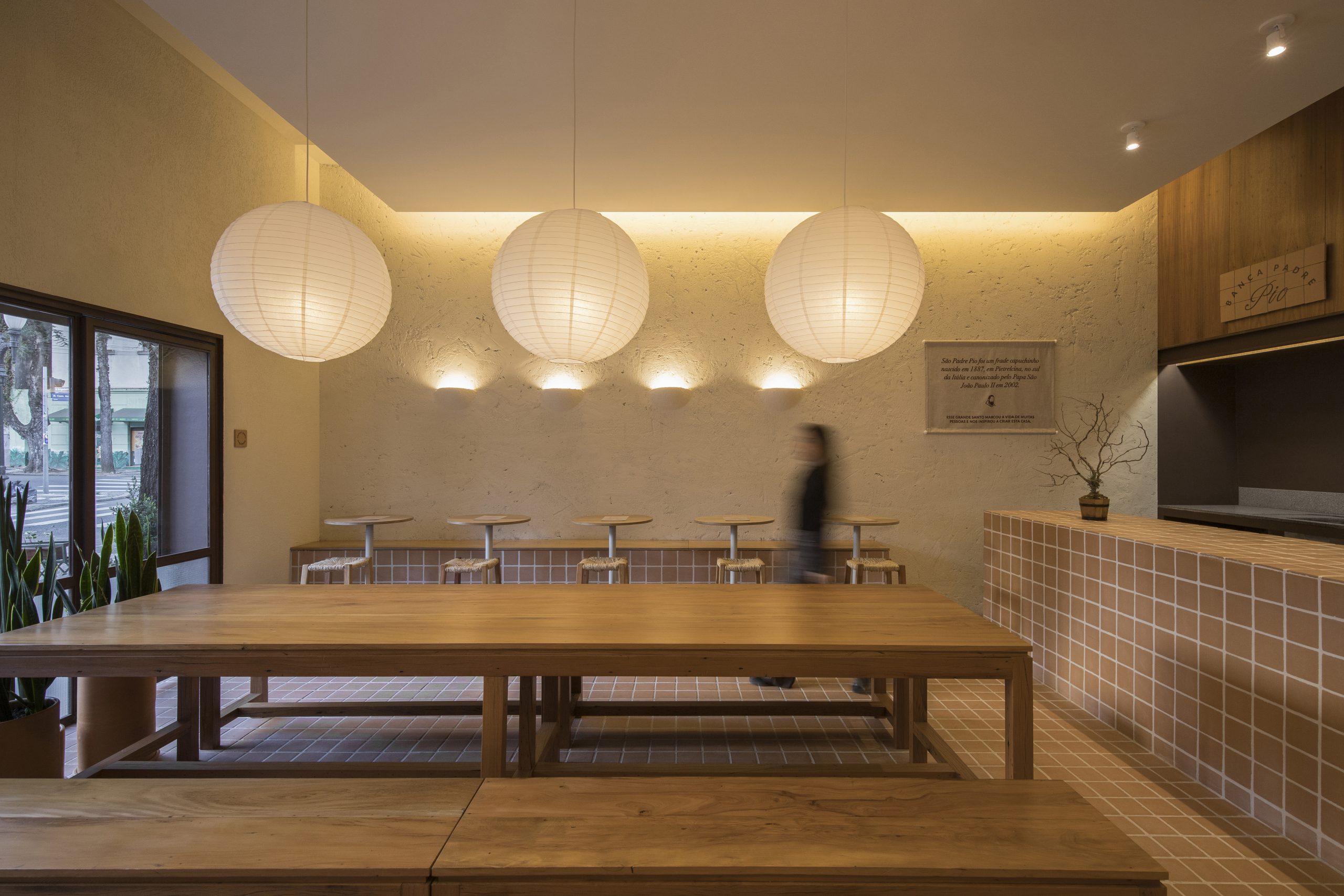 Long communal dining table at Banca Padre Pio