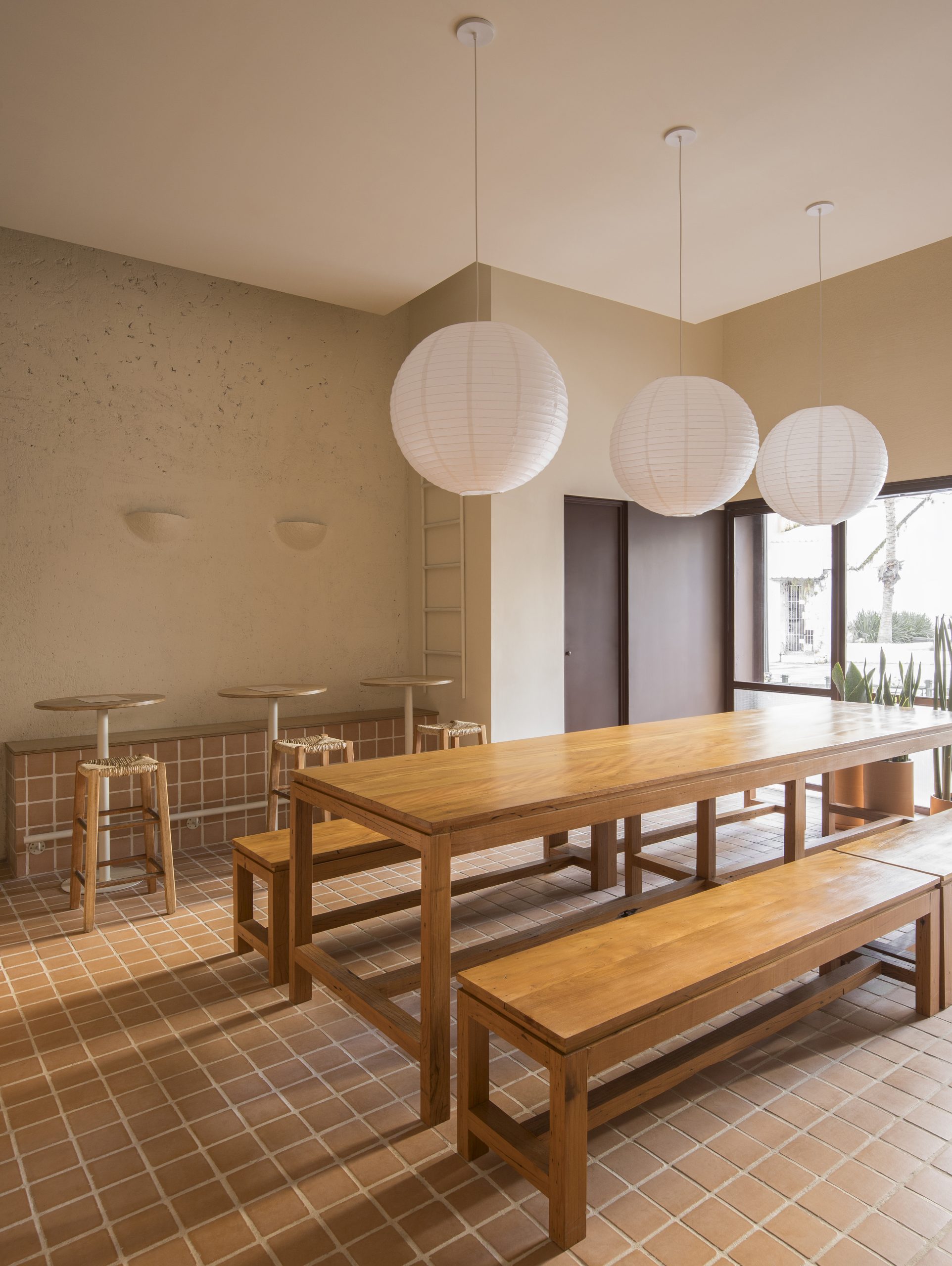 Built-in seating beside the communal table