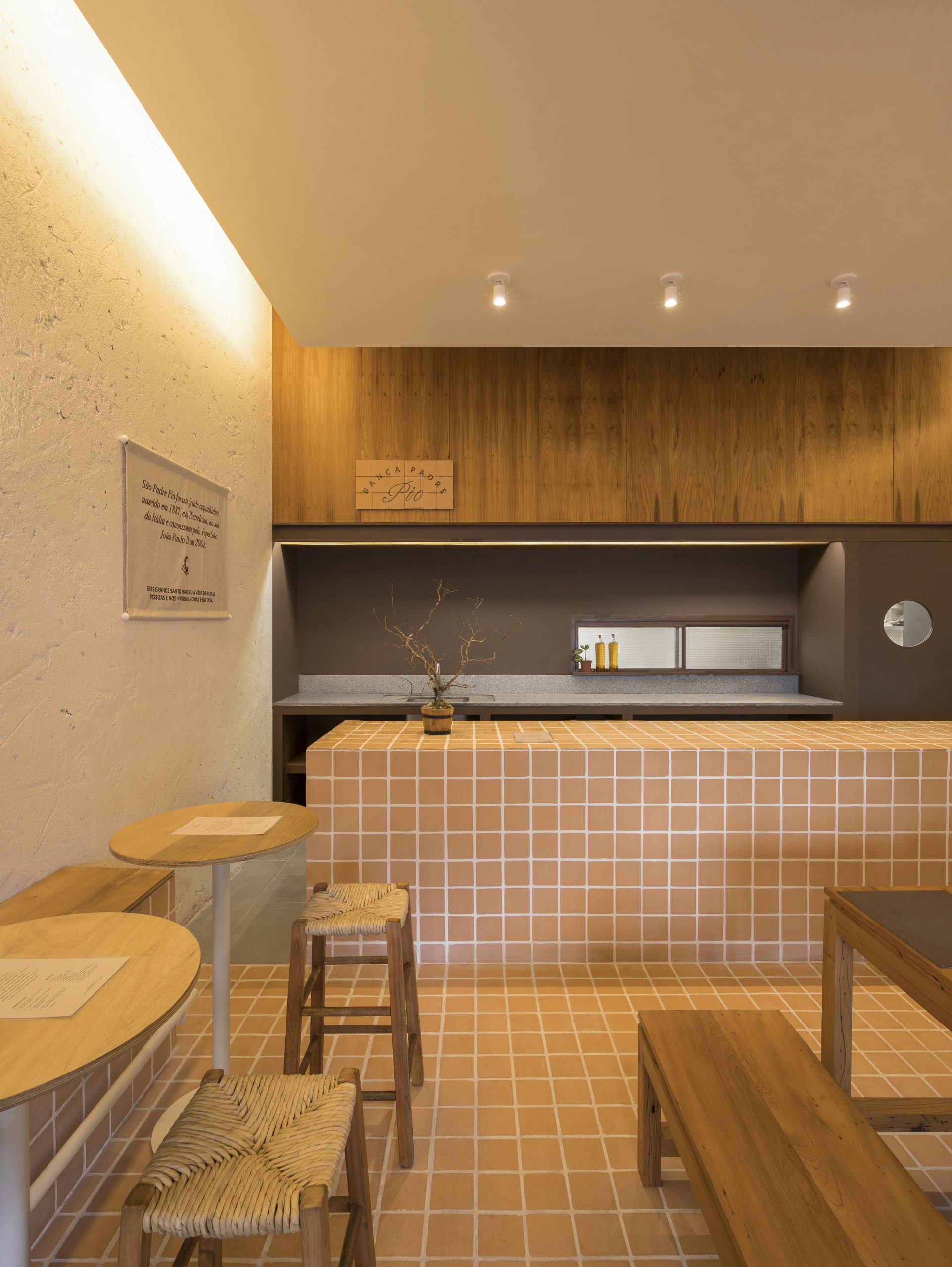 Dining room with ceramic tiled surfaces and timber furniture