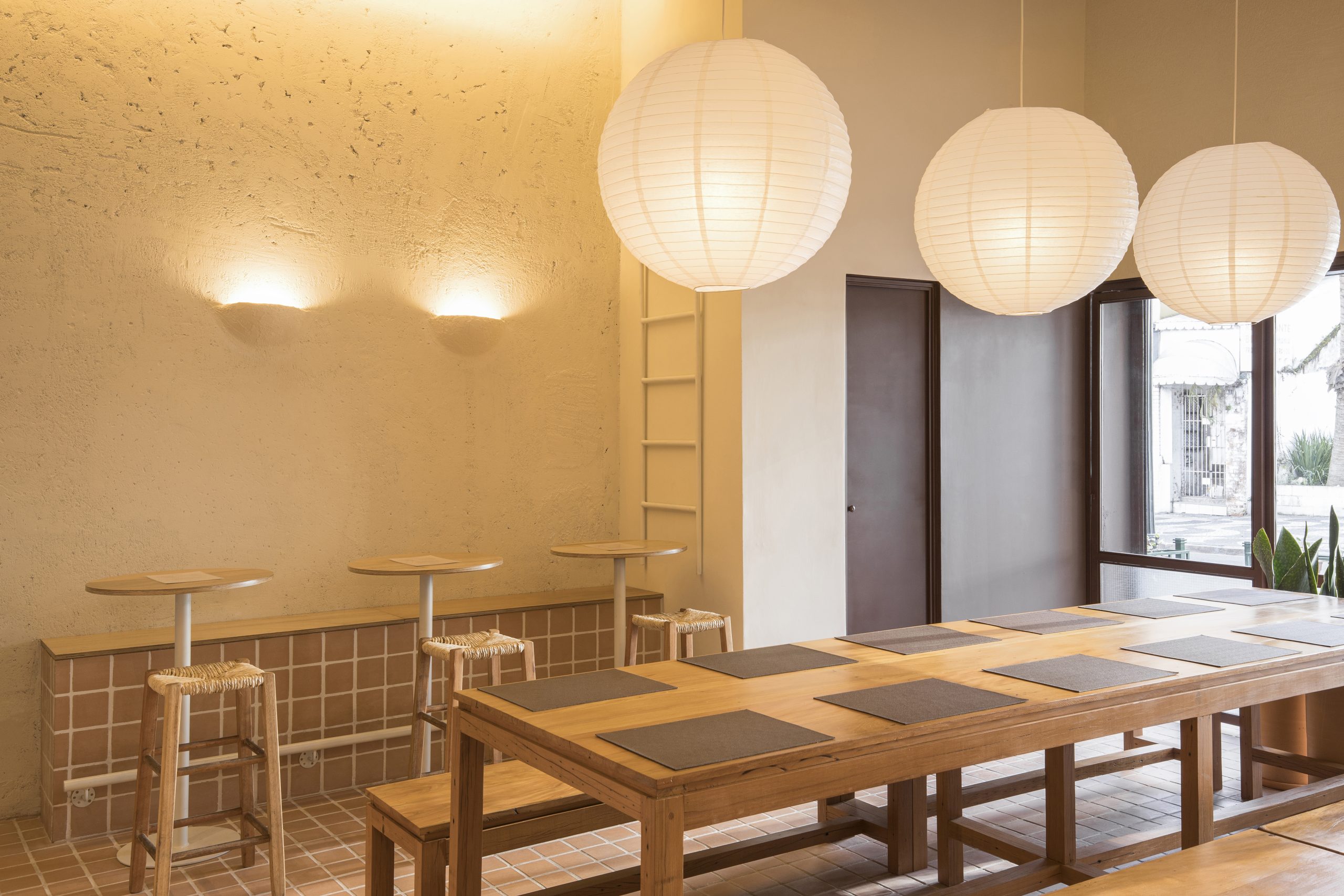 Timber bench and tiled wall inside the restaurant