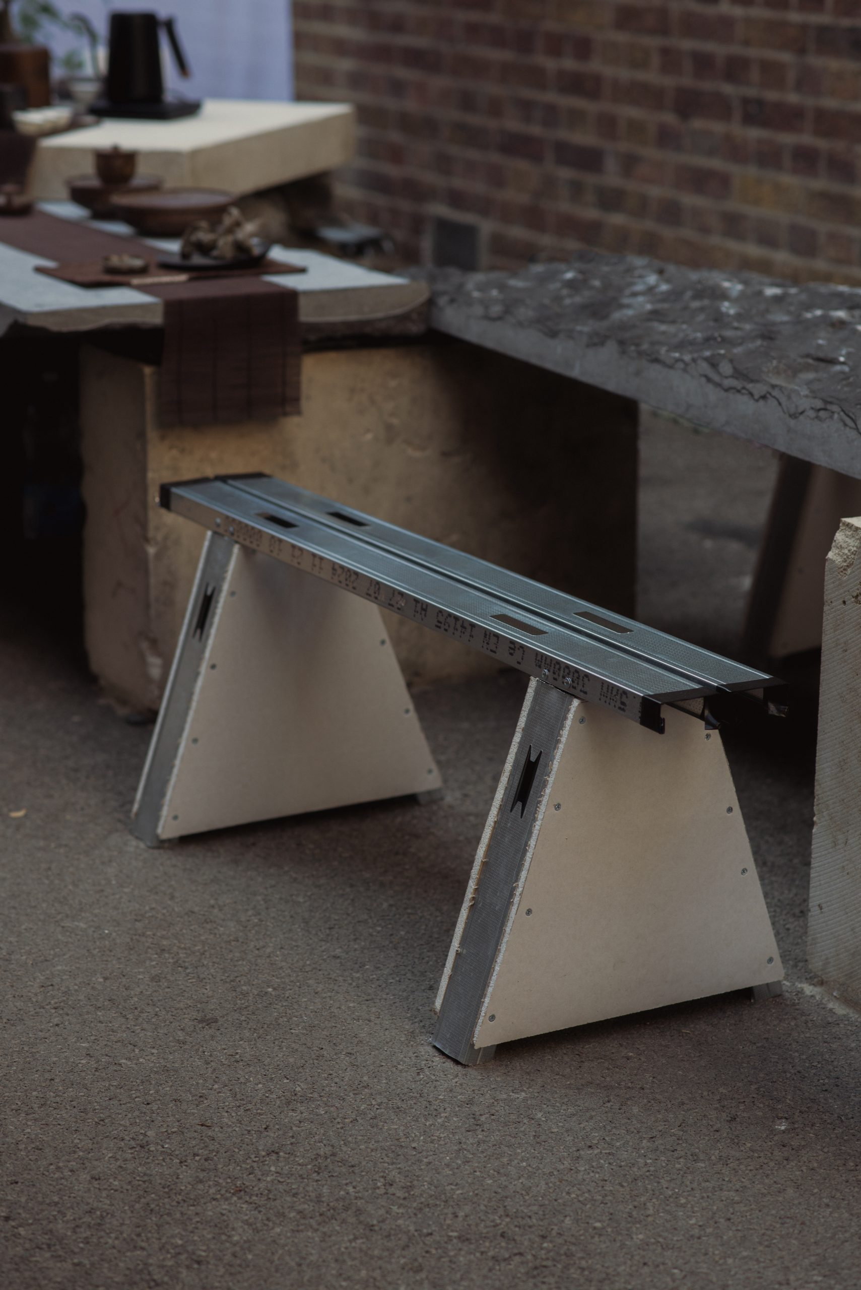 Printed curtain and timber benches in the Zaha Hadid Foundation courtyard