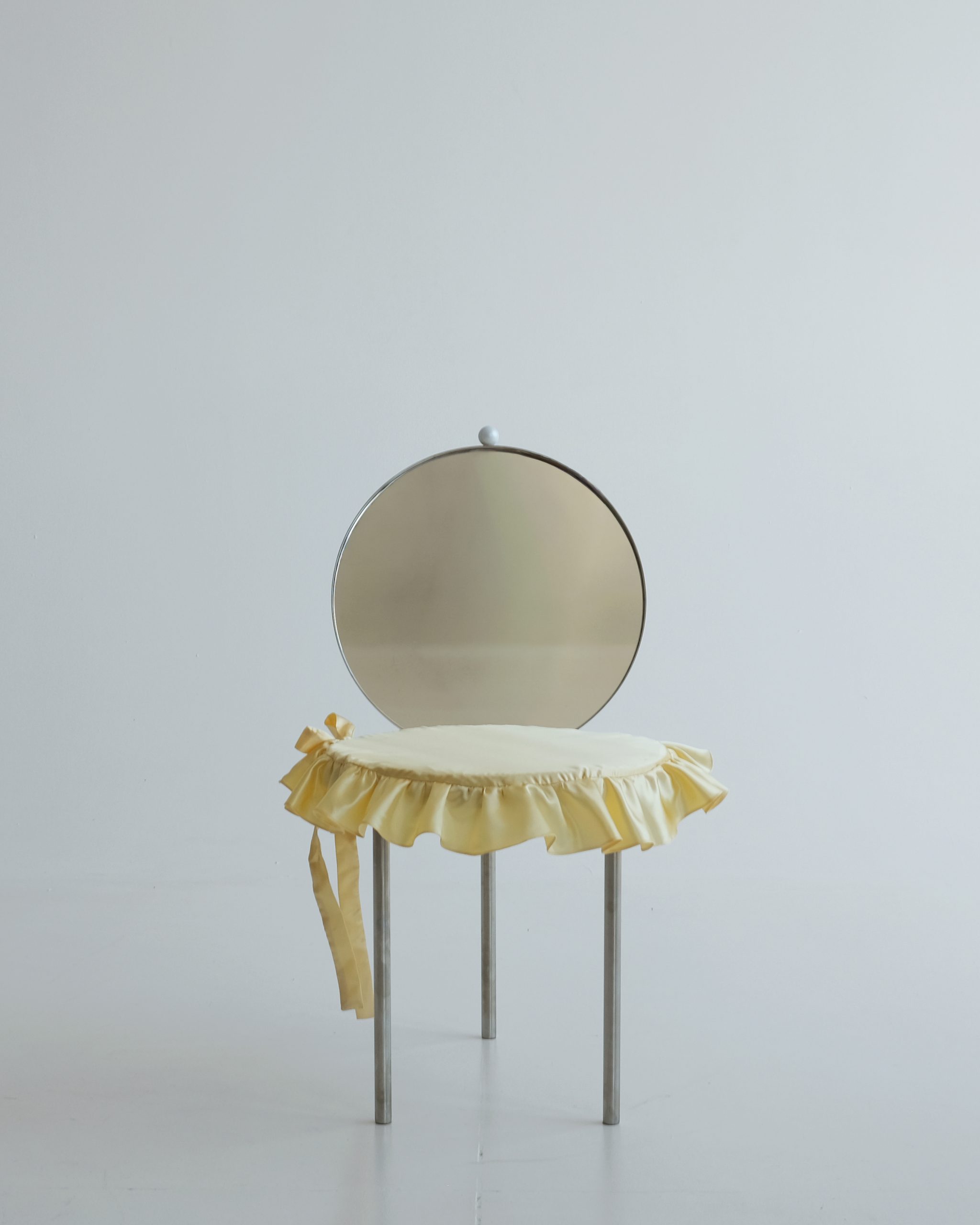 Woman's Chair with its satin frilled cushion