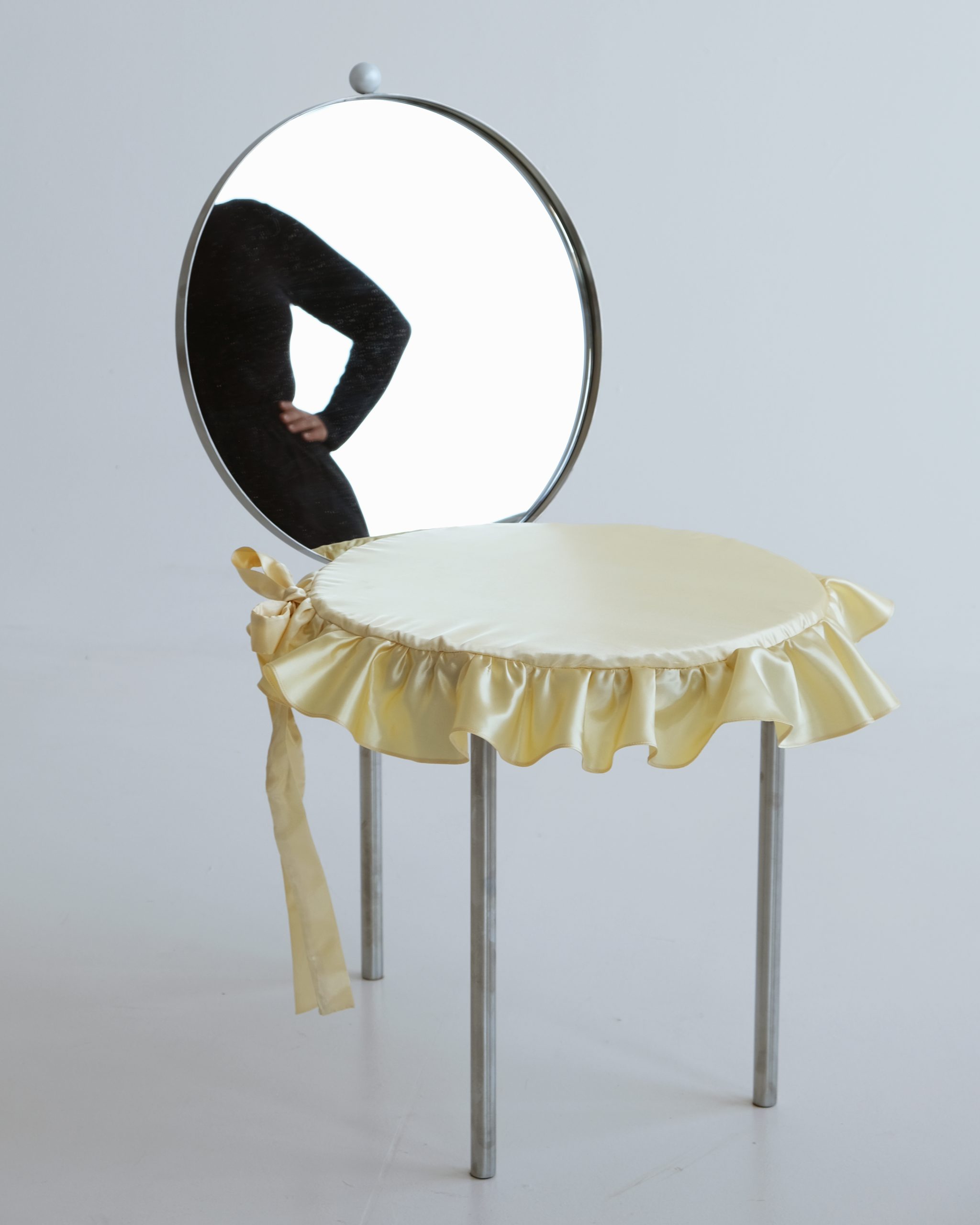 Reflective steel surfaces of the Woman's Chair