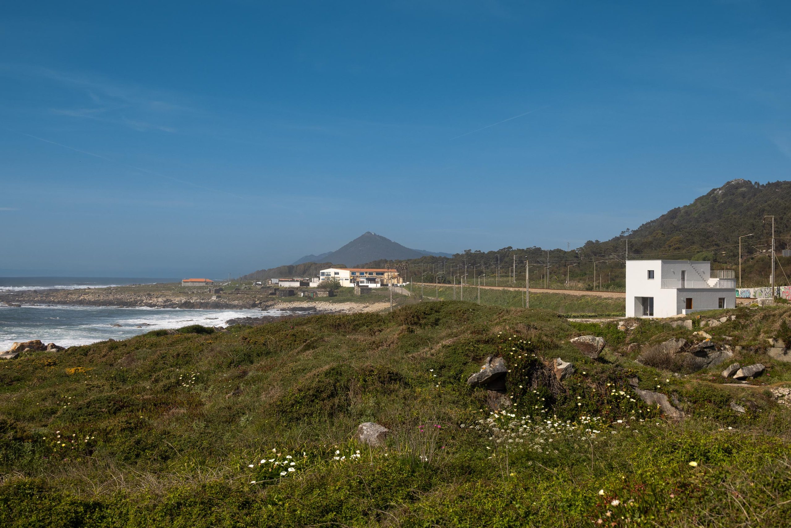 Window in Casa Âncora frames the Atlantic landscape