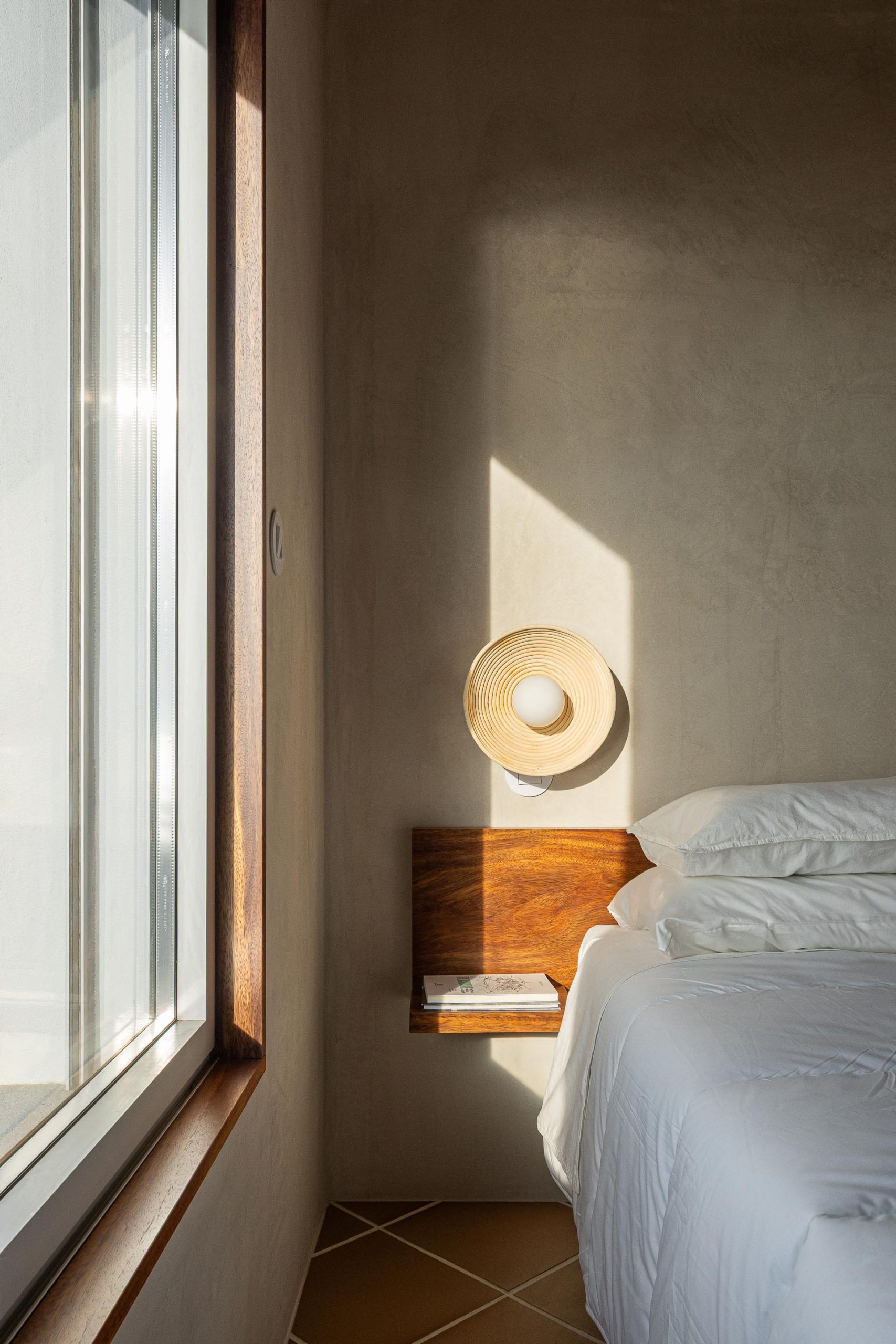 Casa Âncora set against the rugged landscape of Caminha