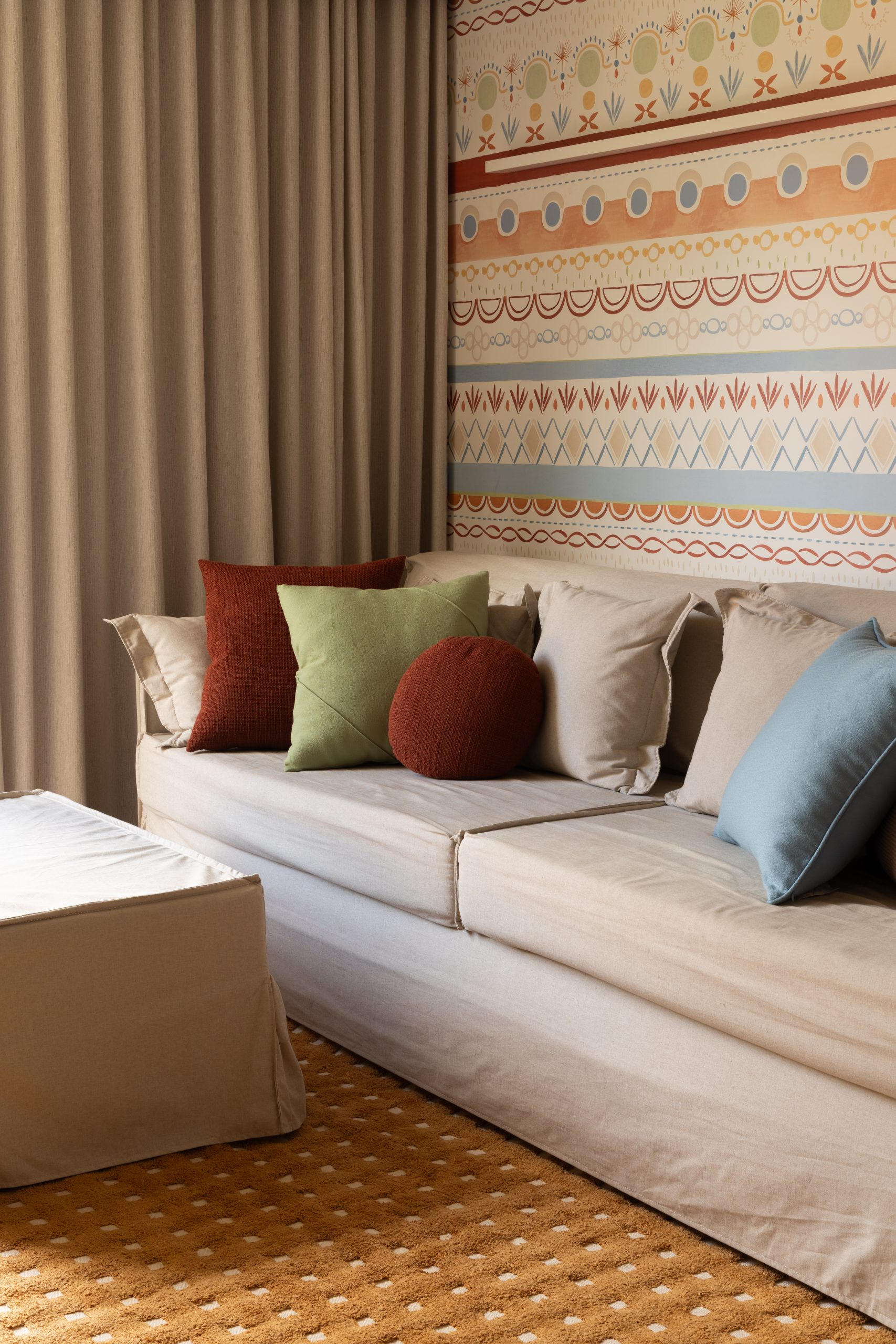 Warm-toned social area of MAS House