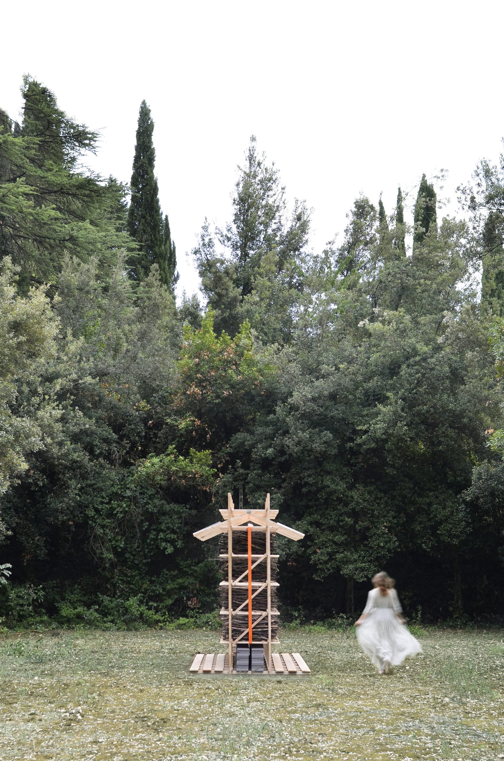 HUT-SPOT stands in a clearing beside woodland in the Romagna hills.