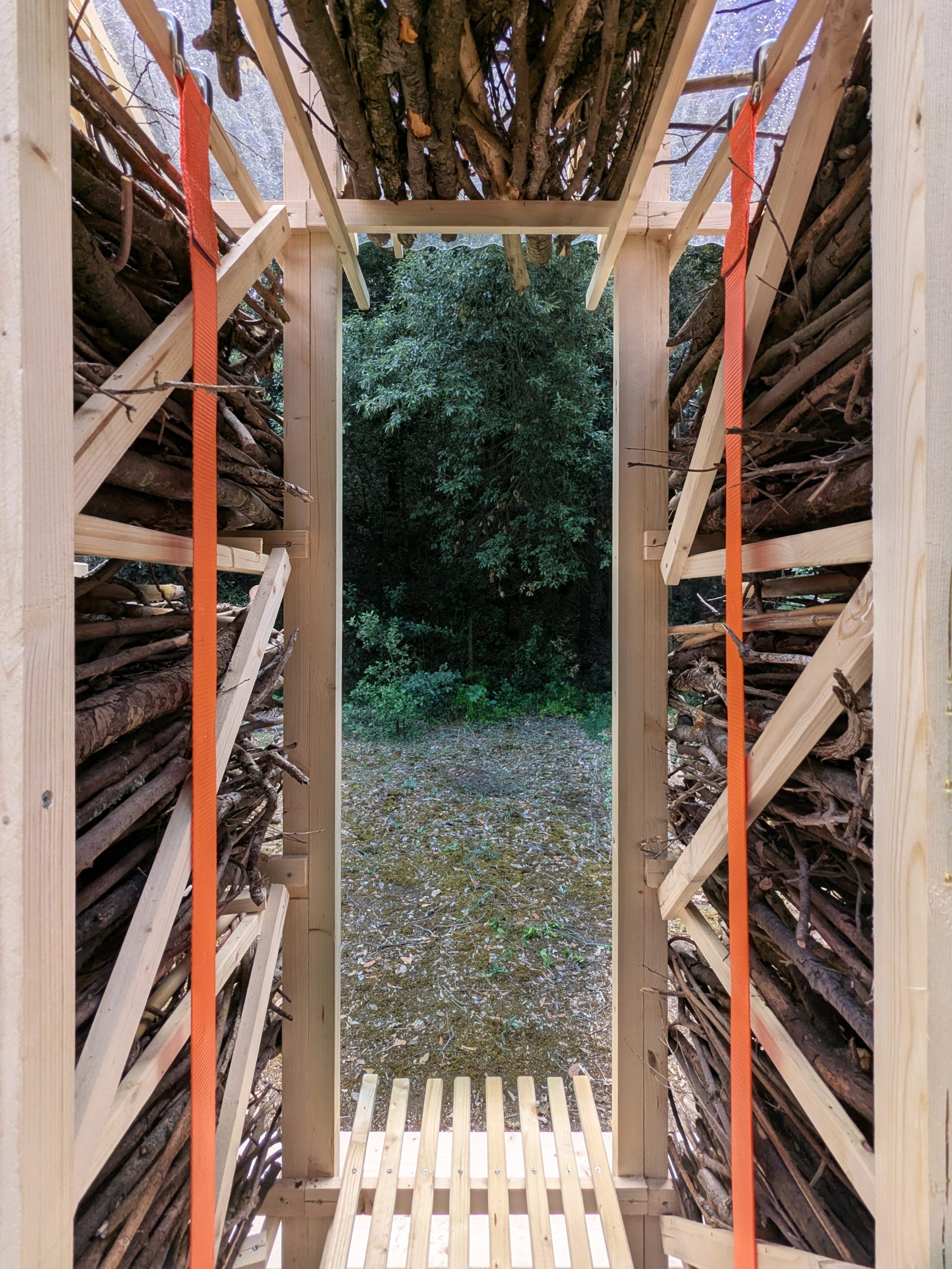 The narrow interior opens towards the surrounding landscape.