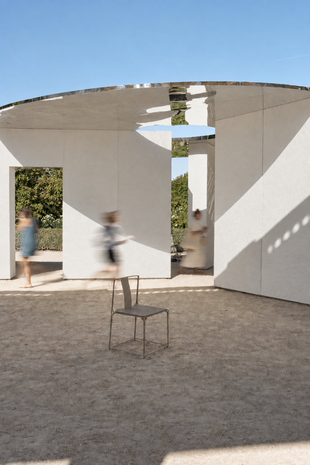 Lightweight seating invites visitors to pause inside the pavilion.