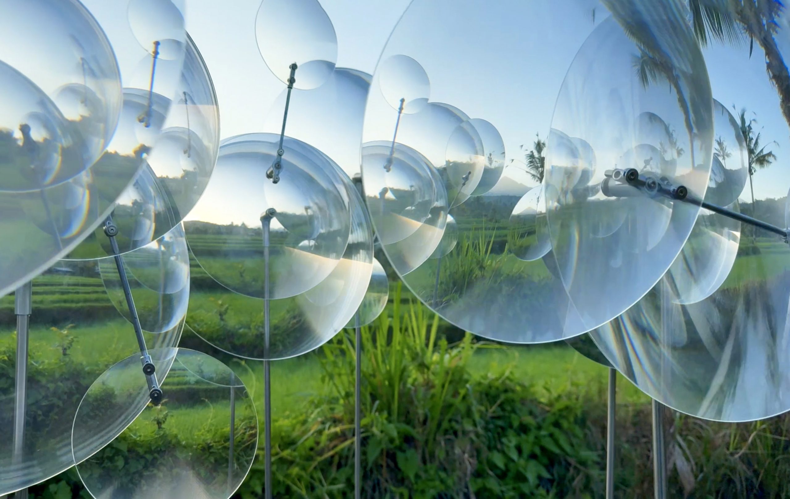 The landscape appears at different scales across overlapping lenses.