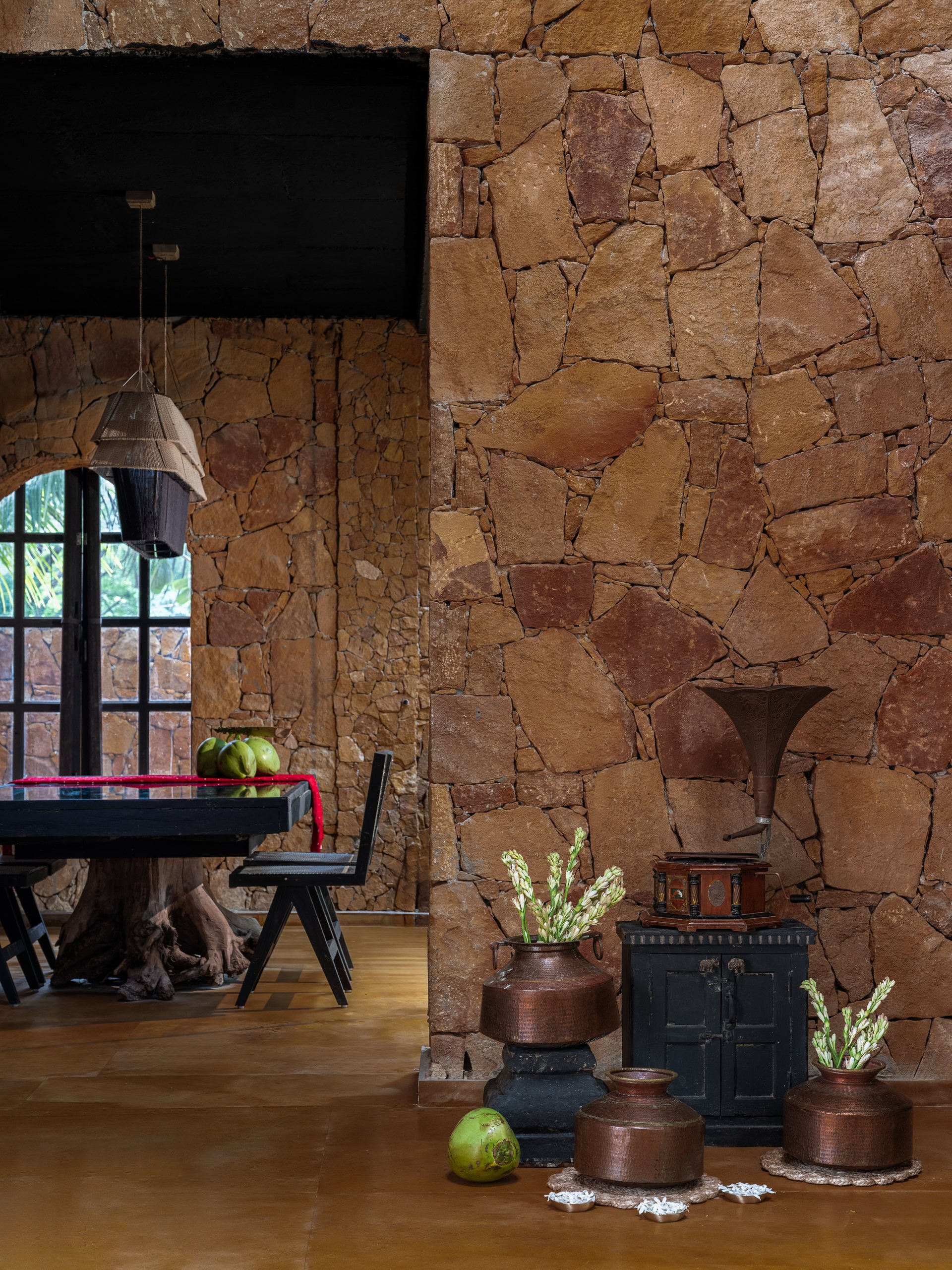 Interior workspace set against a random rubble sandstone wall